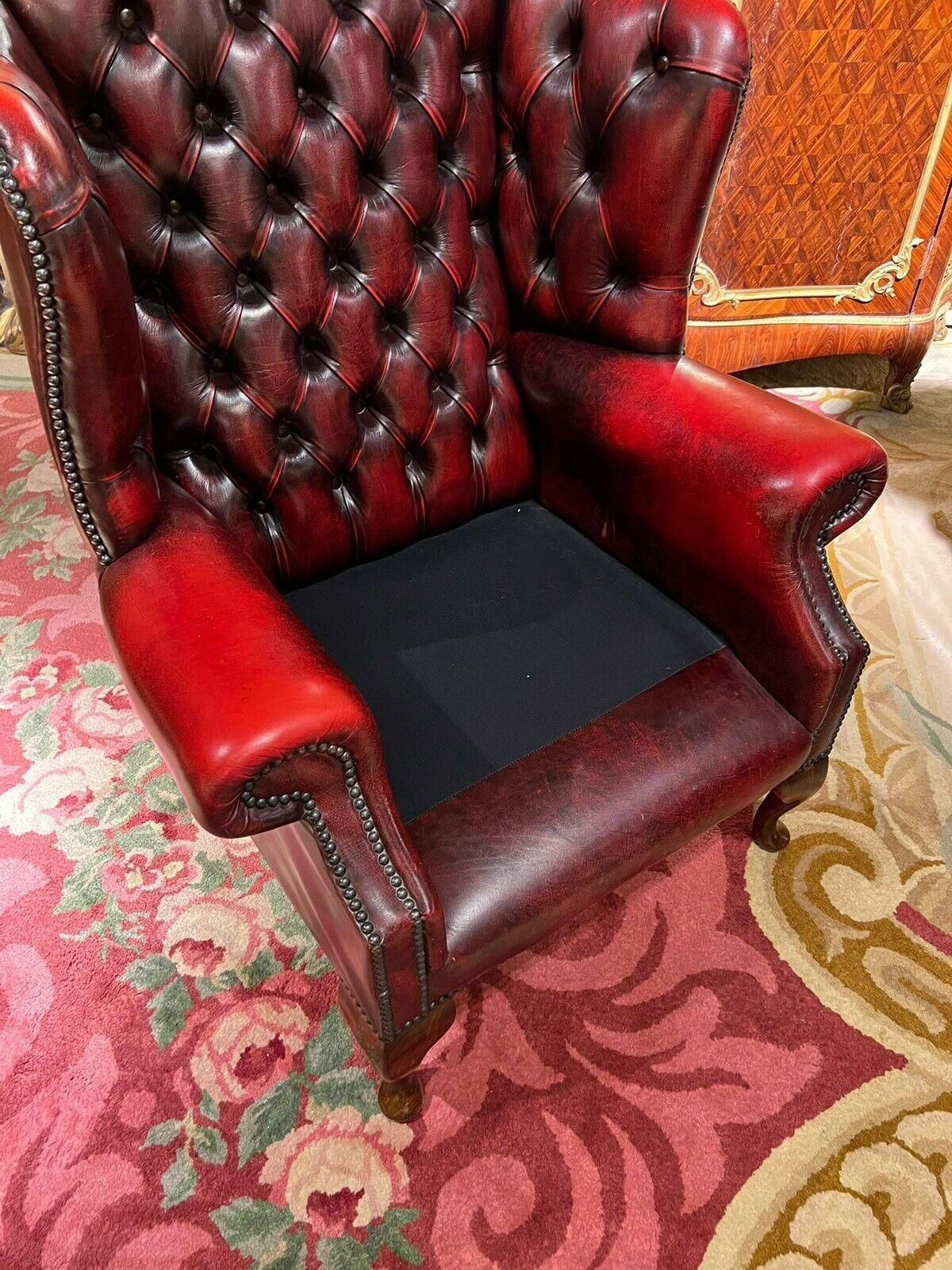 20th Century Vintage original Chesterfield Oxblood Leather Wingback  Armchair and Footstool For Sale