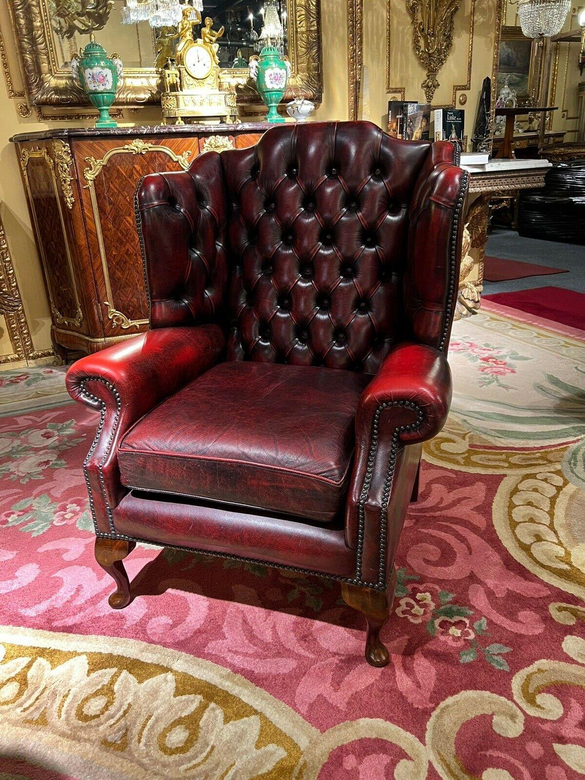 Vintage original Chesterfield Oxblood Leather Wingback  Armchair and Footstool For Sale 1