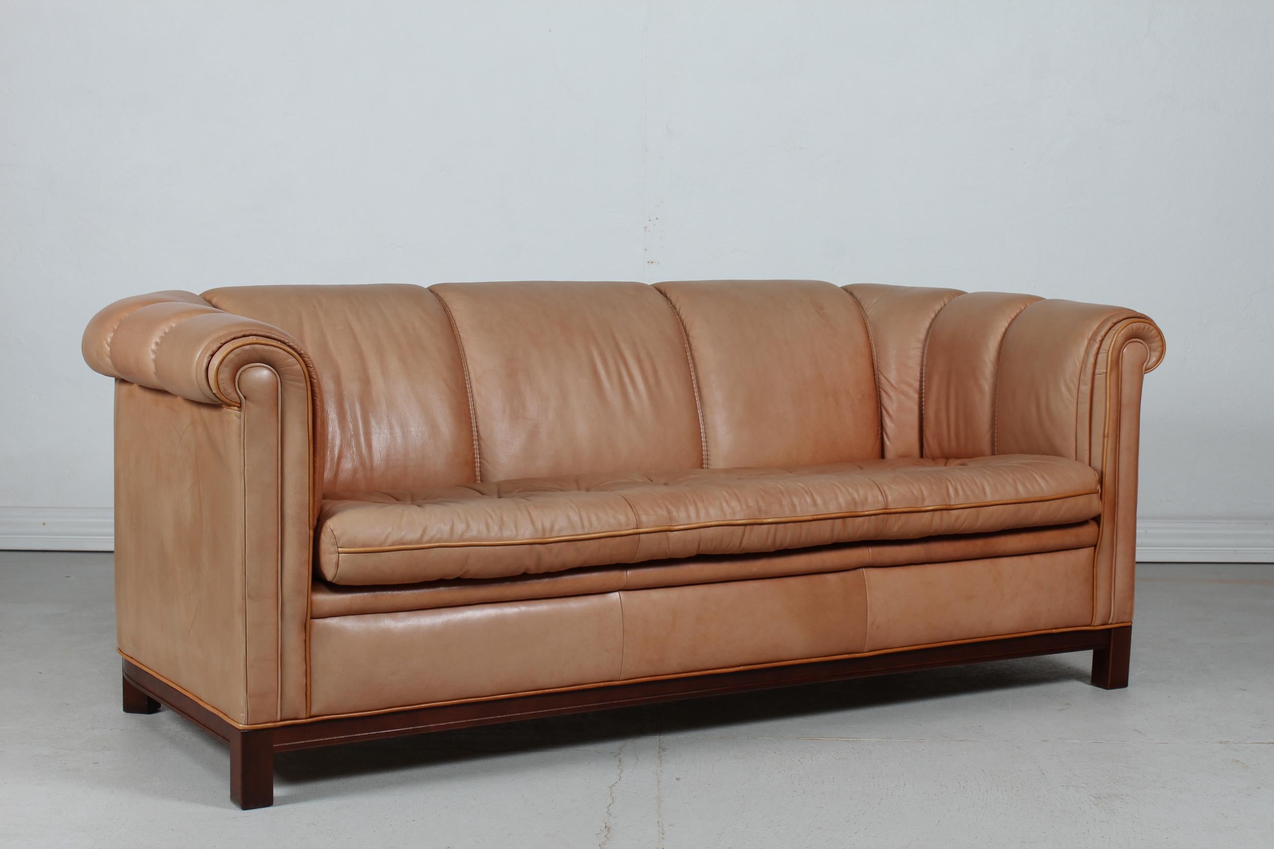 Vintage 3-seat Chesterfield sofa made in the 1970s.
It's upholstered with delicate and good quality cognac colored leather. The frame is made of mahogany.

The sofa is in good vintage condition with patina from sun light and gentle use.
 
   