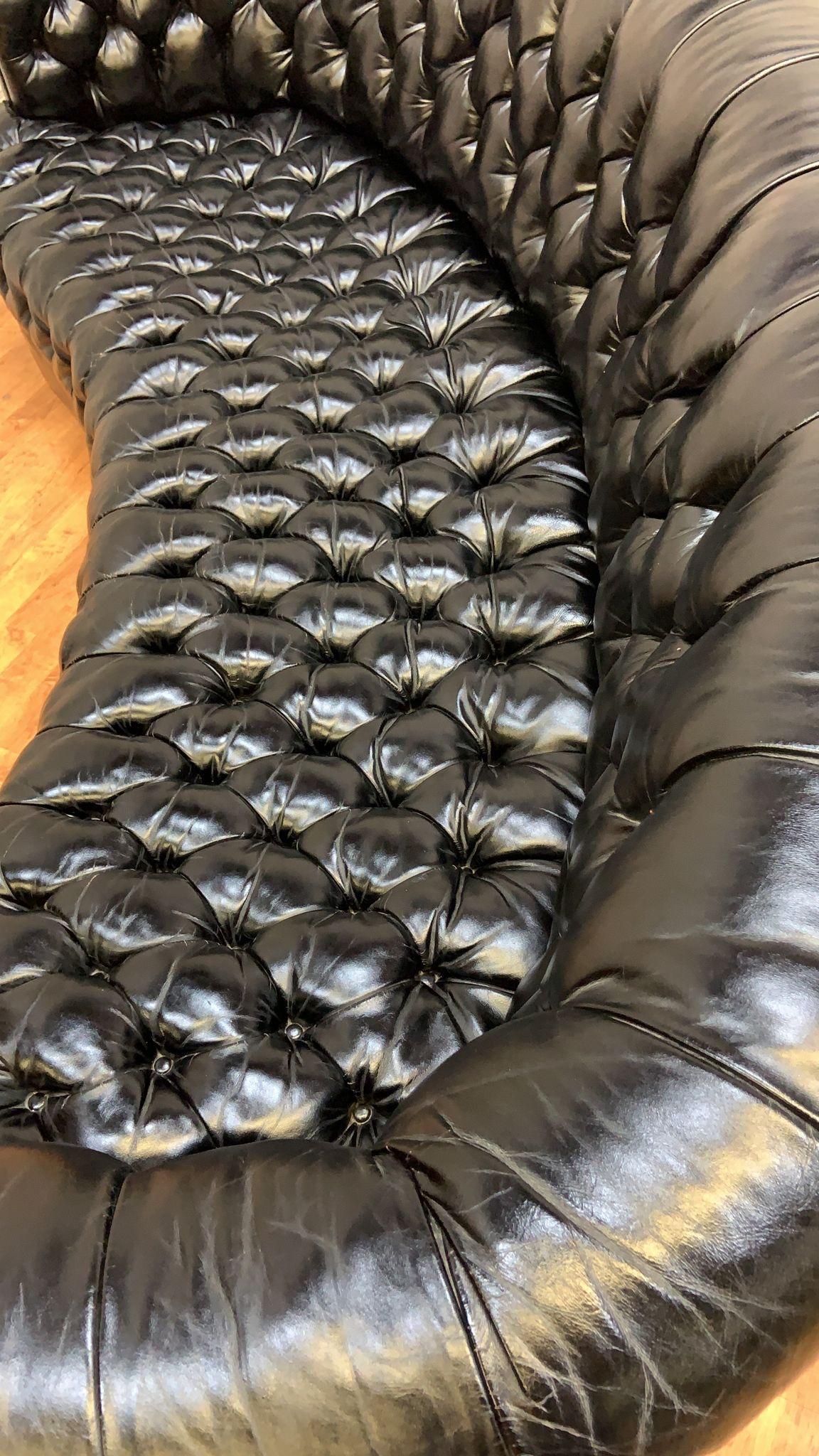 Mid-20th Century Vintage Chesterfield Style Curved Back Black Leatherette Sofa For Sale