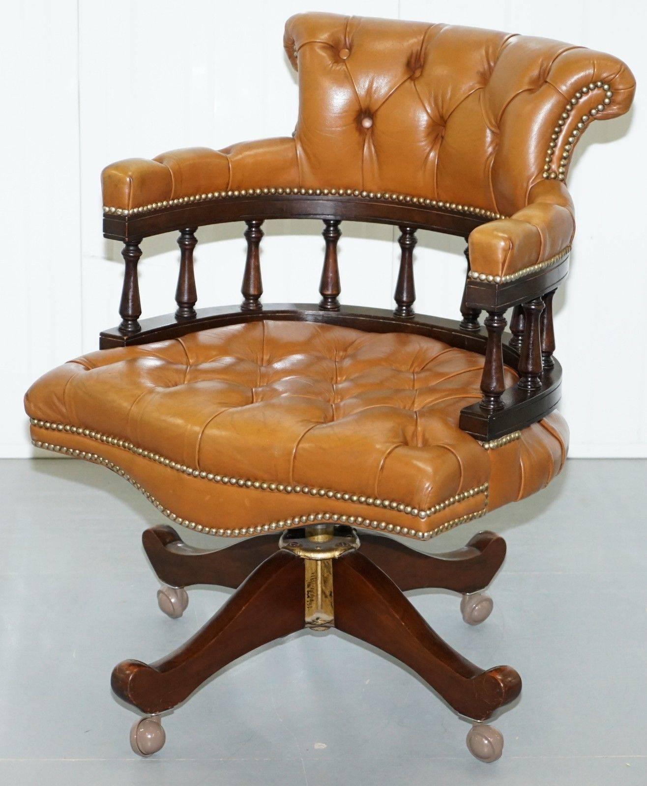 We are delighted to offer for sale this lovely vintage original Chesterfield tan aged brown leather captain’s chair

I have two of these in stock, the other has a slightly darker upholstery 

The chair was made by the Original Chesterfield