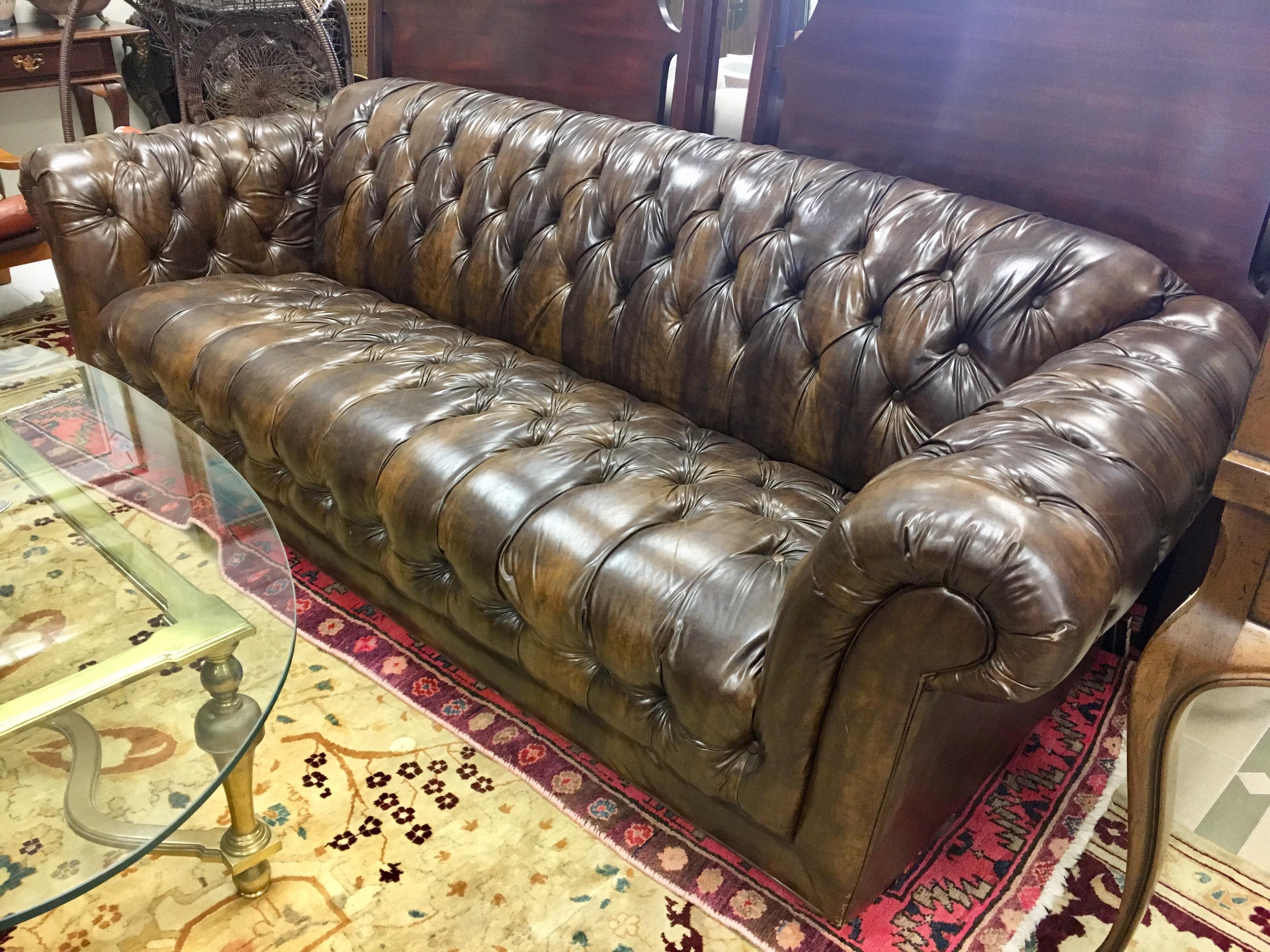 Vintage eight foot Chesterfield sofa from England, circa 1960s. The fabric is a very soft pleather/vinyl.
It sit beautifully which is unusual for chesterfields which sometimes can be uncomfortable.