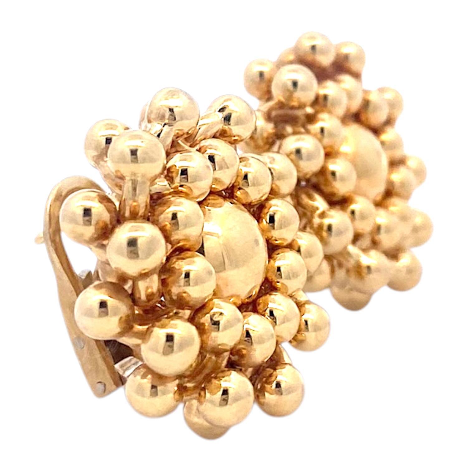 Chiempesa 18K yellow gold earrings featuring a cluster design of polished gold beads. Each earring showcases a central bead surrounded by concentric circles of smaller beads, creating a textured, dimensional effect. Bright polish finish enhances the