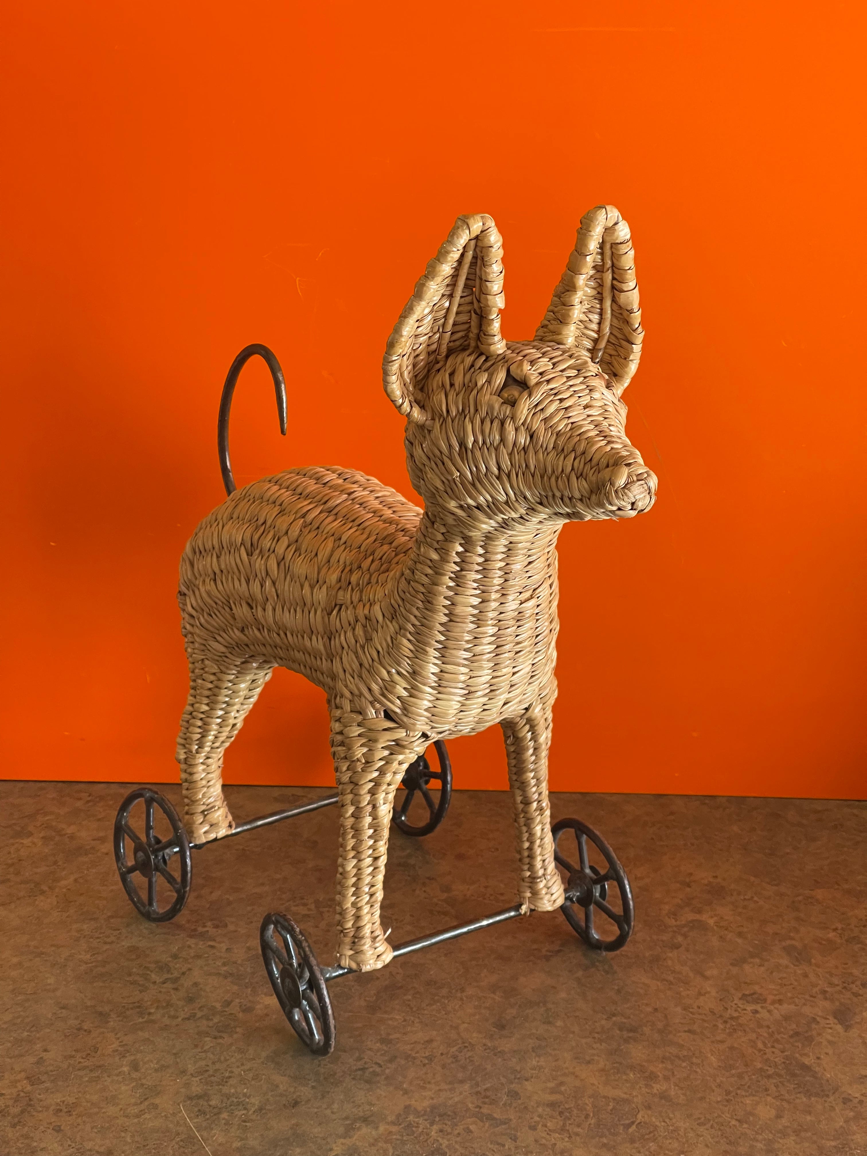 A very rare and fun vintage Chihuahua pull toy / sculpture by Mario Lopez Torres, circa 1974. The piece is in great vintage condition and measures 8