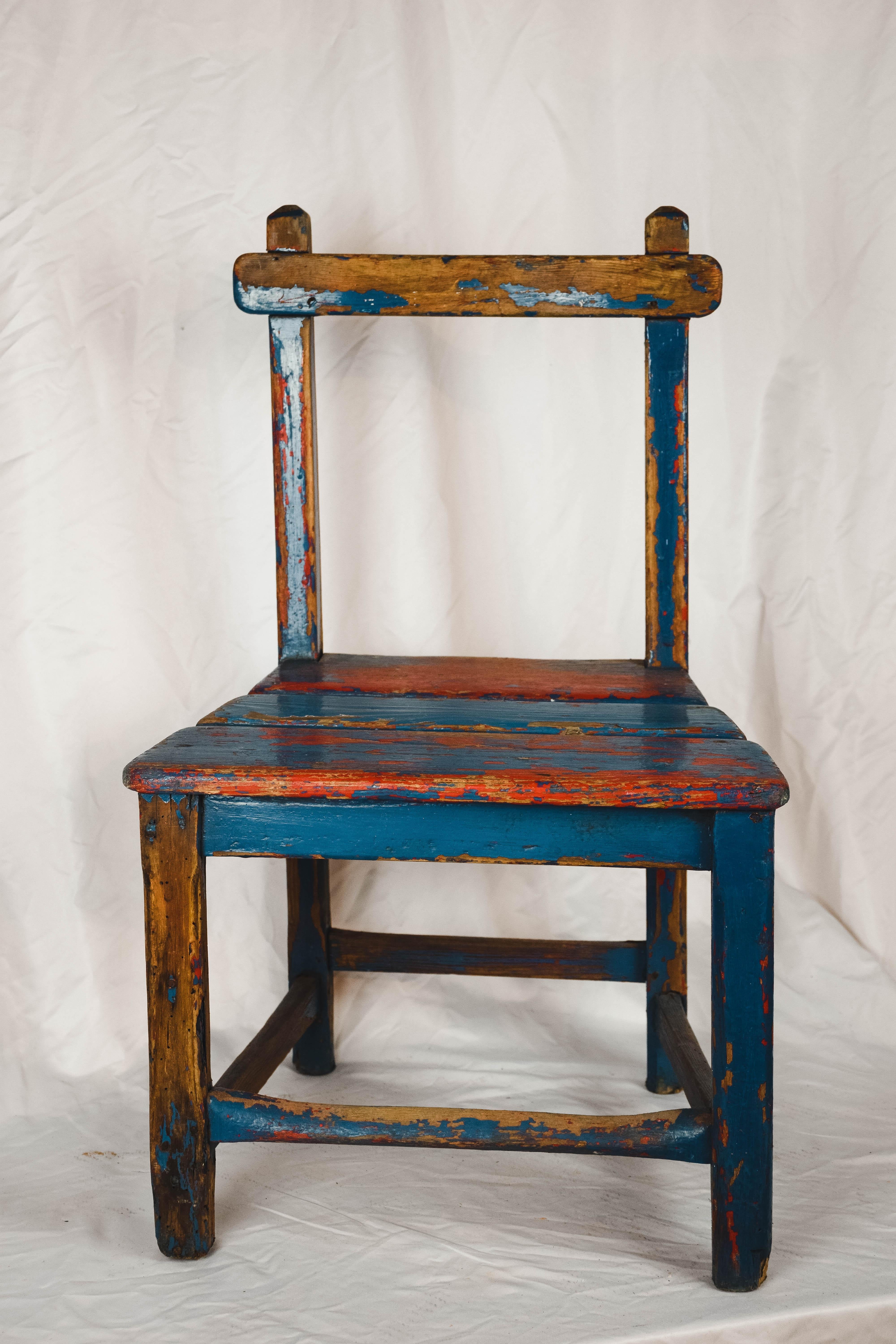 A cute vintage child's chair from France. Handmade from pine with a charming worn red and blue painted patina. This would delight any child wanting his 'own chair' and would be charming just sitting alone beside the hearth.