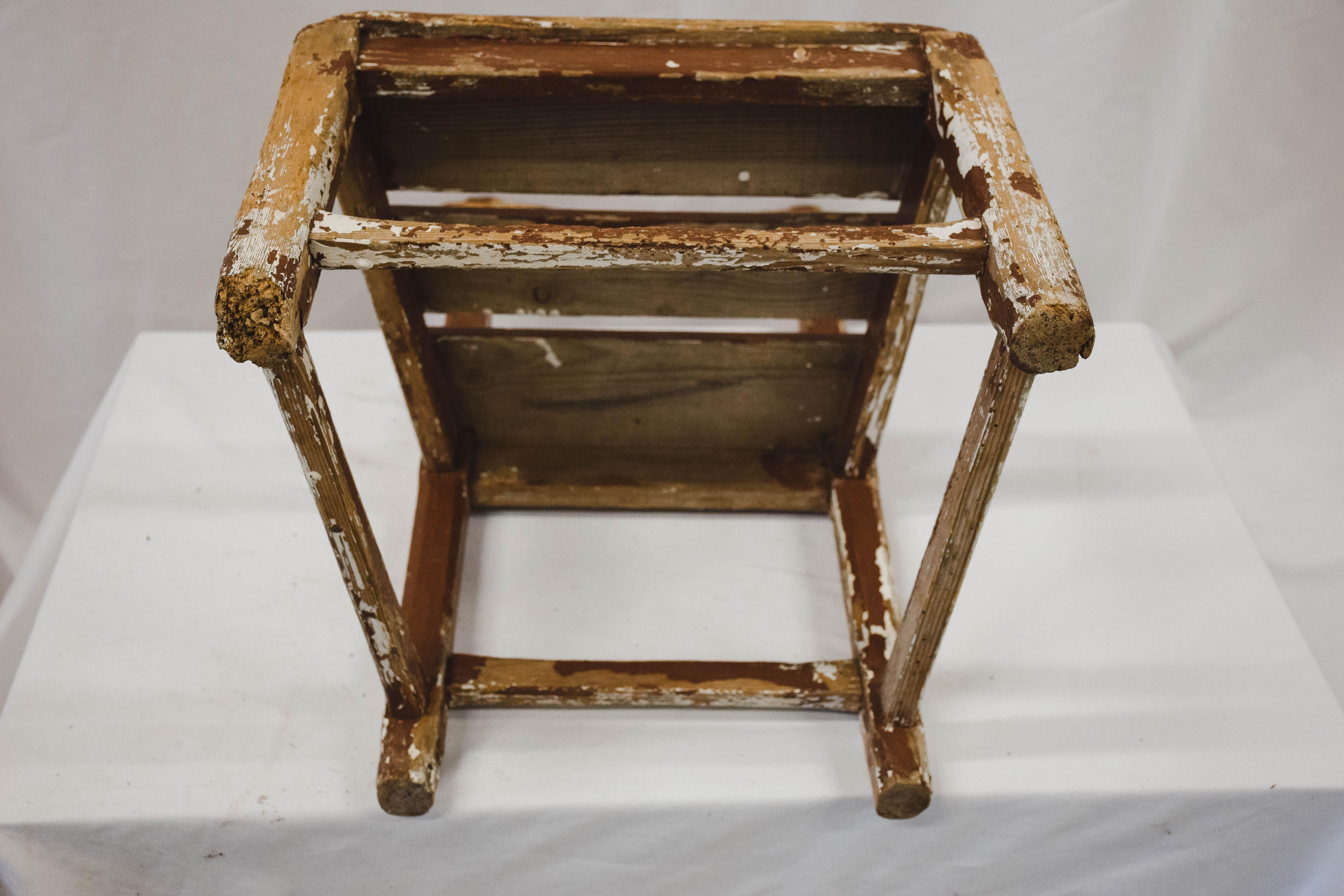 A cute vintage child's chair from France. Handmade from pine with a charming worn patina. Hints of the original white paint remains. This would delight any child wanting his 'own chair' and would be charming just sitting alone beside the hearth.