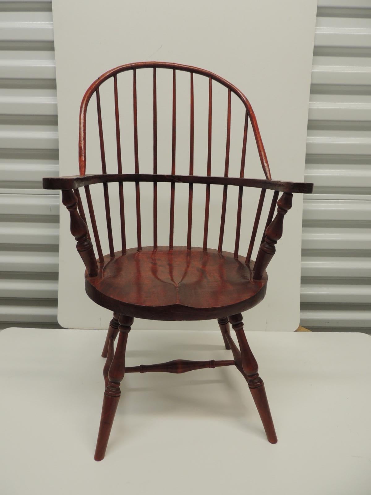 Vintage child's Windsor armchair.
Wood sturdy chair with oval seat and oval back, stained a reddish cherry color.
Size: 14 W x 9.5 SH x 13 D x 23 BH x 9 SD.