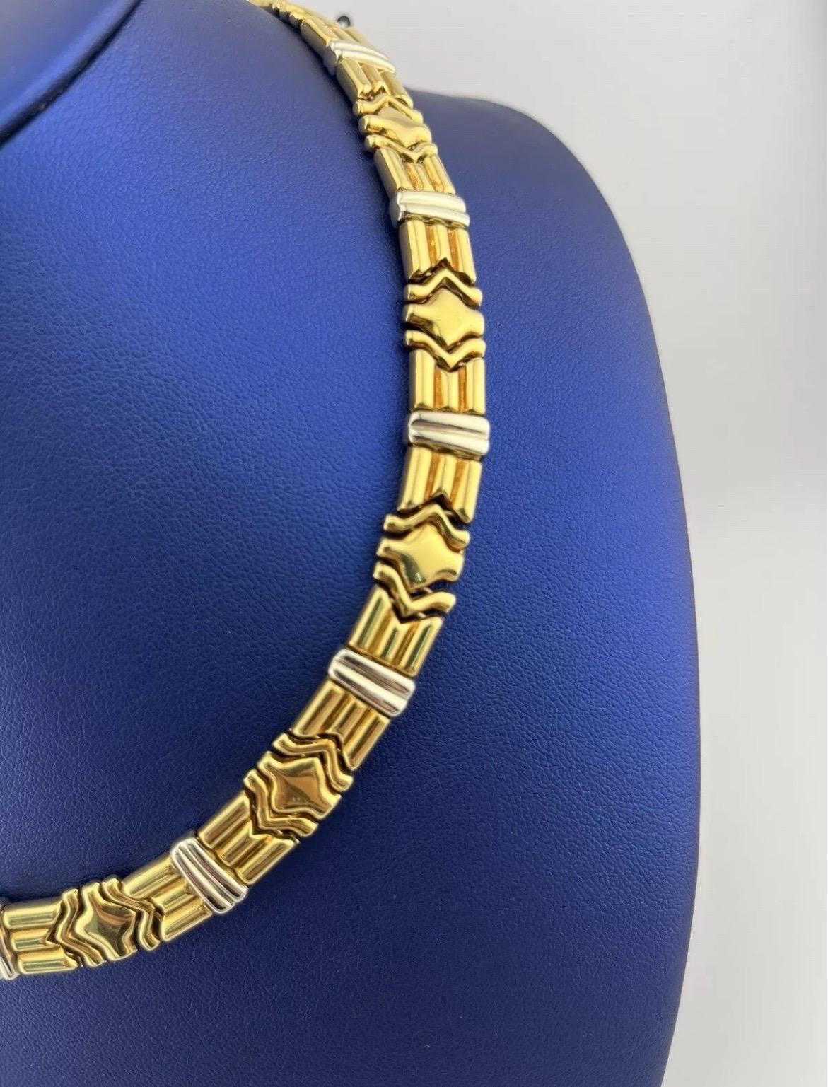 The Vintage Chimento 18kt Two-Tone Yellow & White Gold Unique Link Necklace is a stunning example of Italian craftsmanship and timeless design. Made from a luxurious blend of 18kt yellow and white gold, this necklace features a series of uniquely