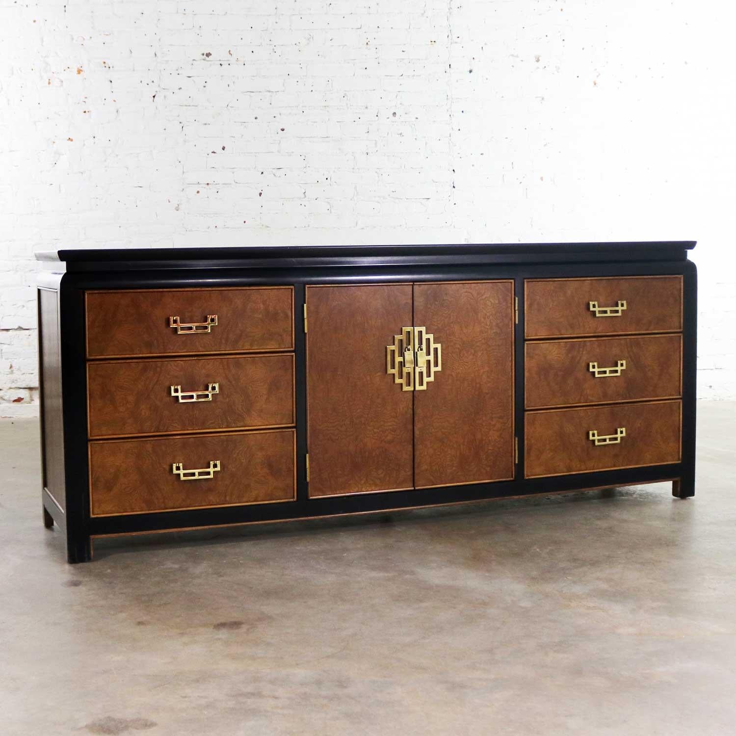 Handsome Hollywood Regency chinoiserie low dresser or console cabinet designed by Raymond K. Sobota for his Chin Hua Collection for Century Furniture. It is in wonderful vintage condition overall. It does have normal signs of age but nothing