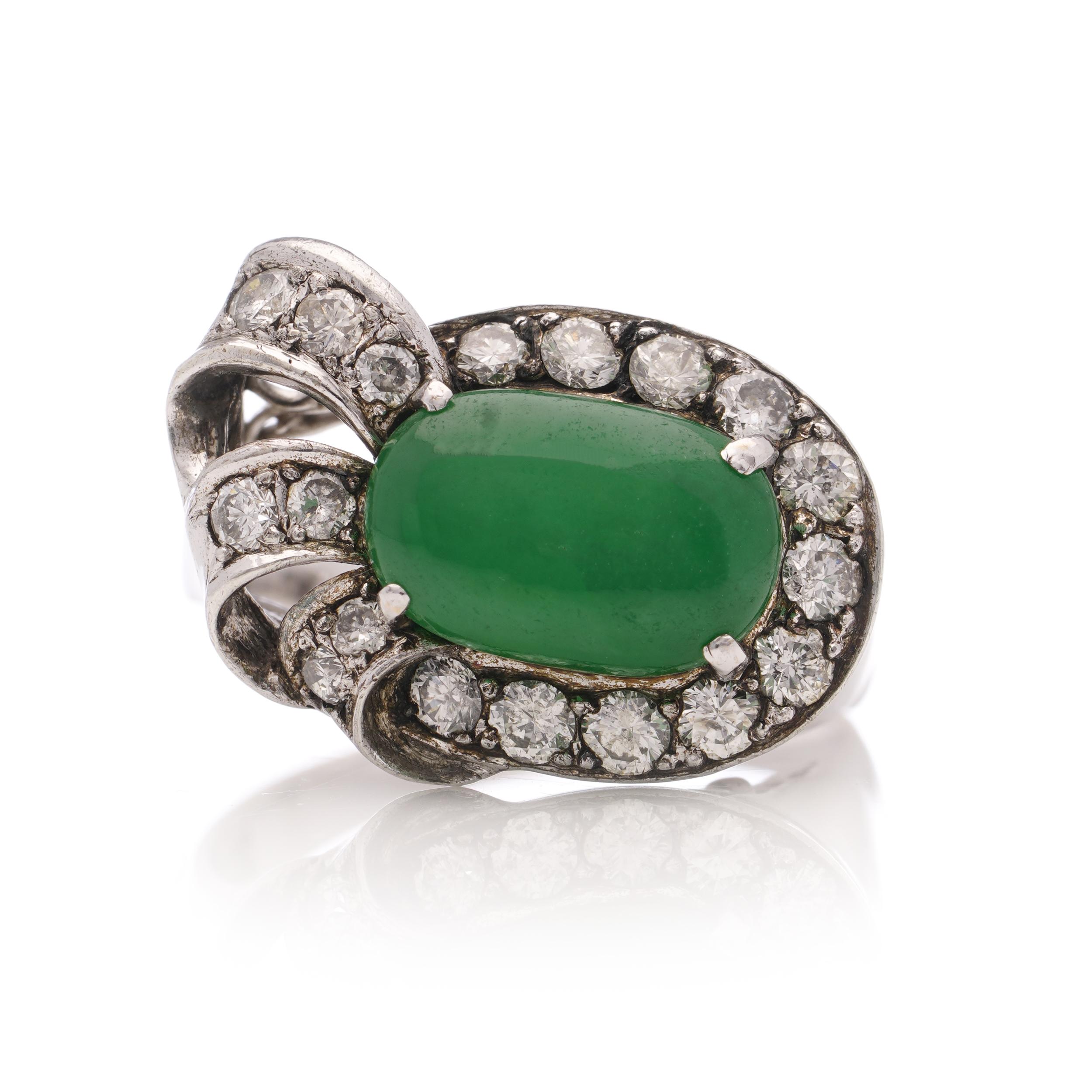 Vintage 18kt. white gold natural Colombian emerald and diamond ring. 

Made China, Circa 1980 - 1990's 
Hallmarked with Chinese marks and 18kt. gold mark. 

Dimensions -
Finger Size (UK) = M 1/2 (EU) = 54.5 (US) = 6.5
Weight: 5.00 grams
Ring Size:
