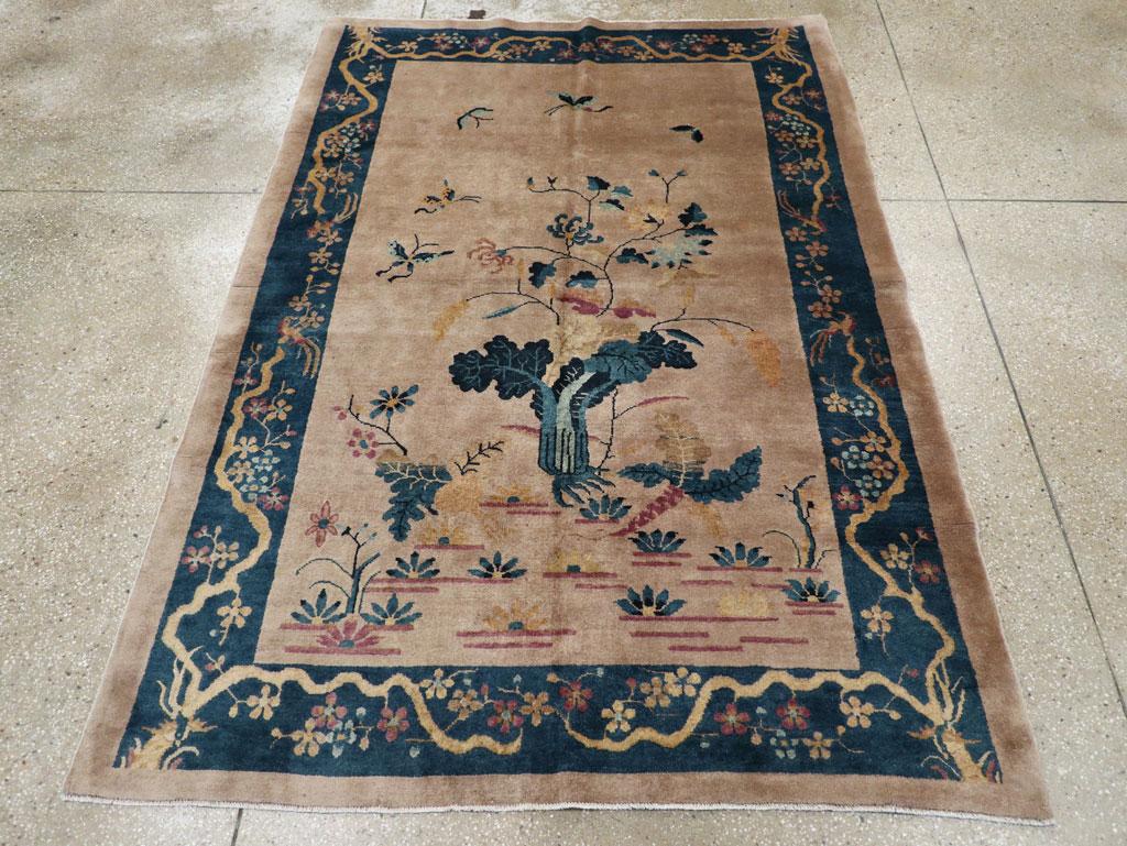 This mid-20th century Chinese Art Deco rug, measuring 5' 2