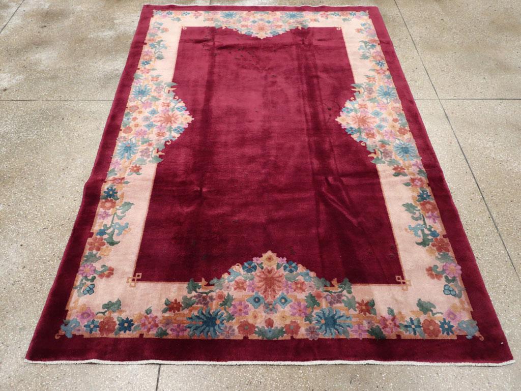 This mid-20th century Chinese Art Deco rug, measuring 5' 10