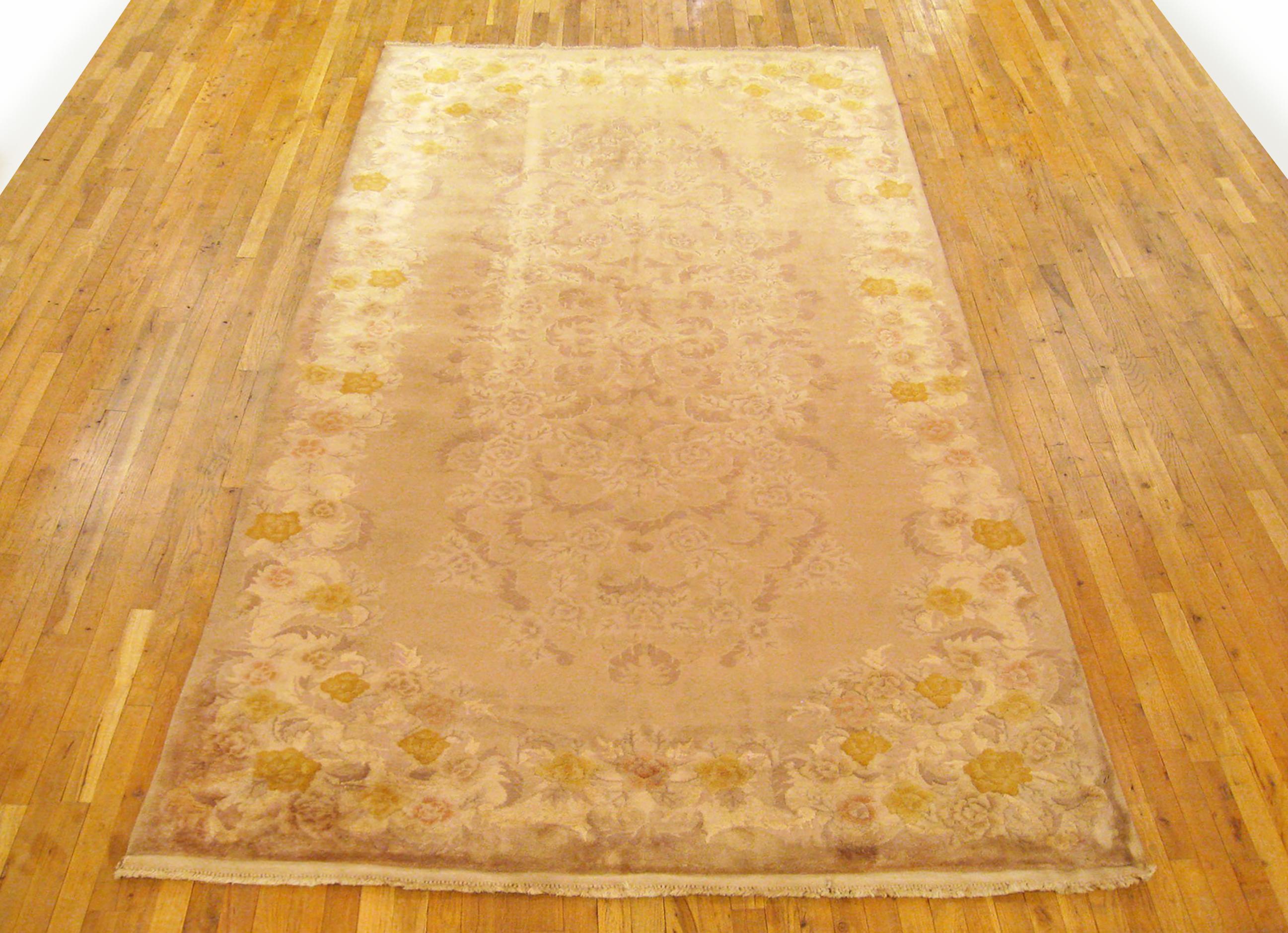 Vintage Chinese Art Deco Rug, Gallery size, circa 1940

A one-of-a-kind antique Chinese Art Deco oriental carpet, hand-knotted with medium thickness wool pile. This beautiful hand-knotted rug features floral elements in a large brown open field,