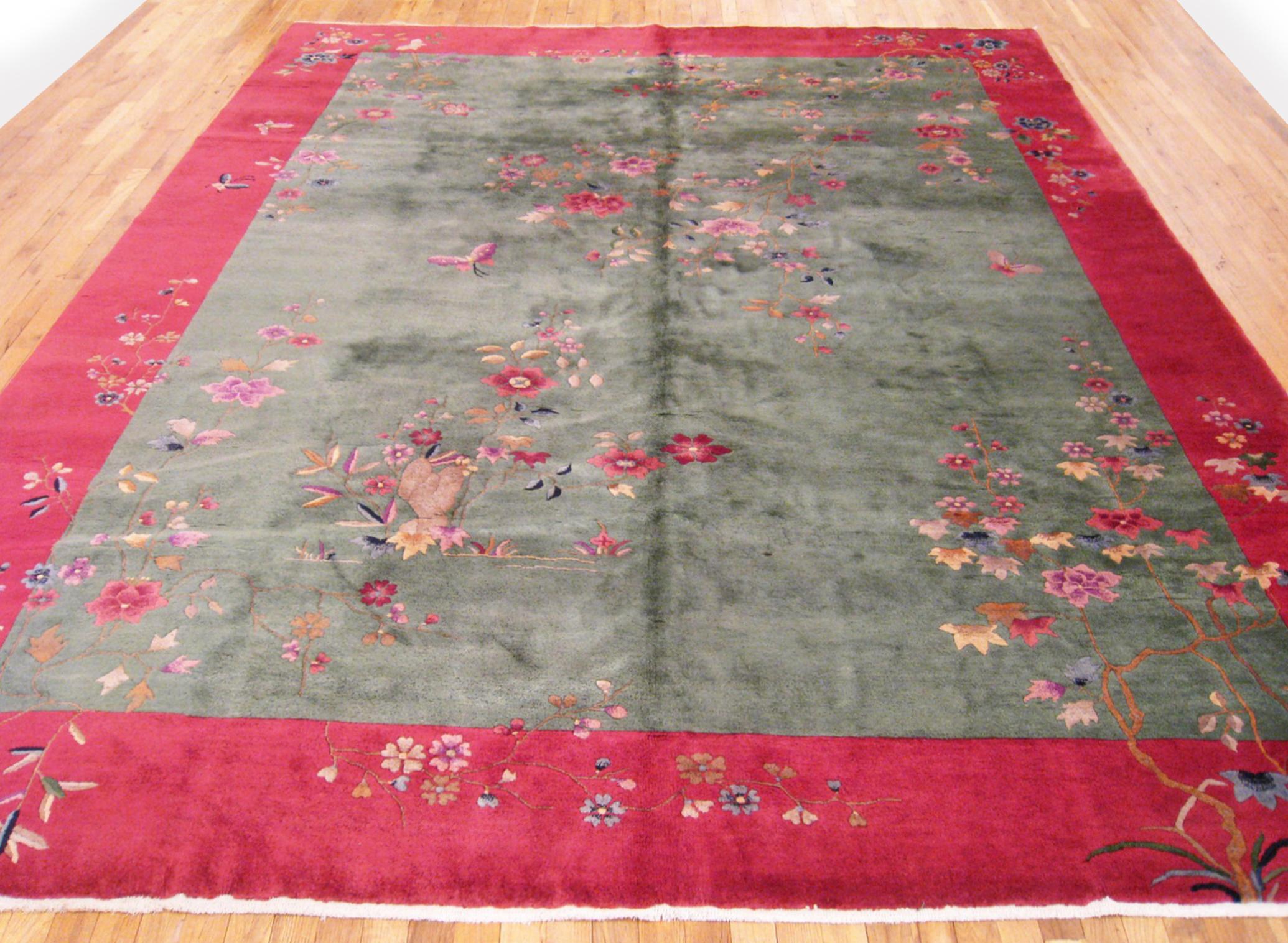 Vintage Chinese Art deco Rug, room size, circa 1920.

A one-of-a-kind antique Chinese Art deco oriental carpet, hand-knotted with medium thickness wool pile. This beautiful hand-knotted rug features floral elements in a large green open field,