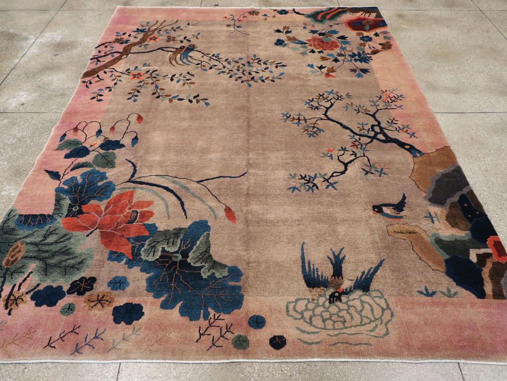 This mid-20th century Chinese Art Deco rug, measuring 8' 10