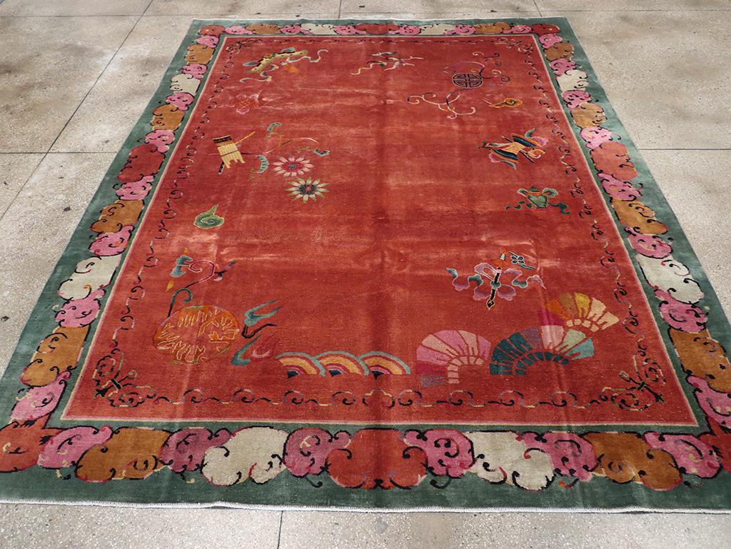 This mid-20th century Chinese Art Deco rug, measuring 8' 10