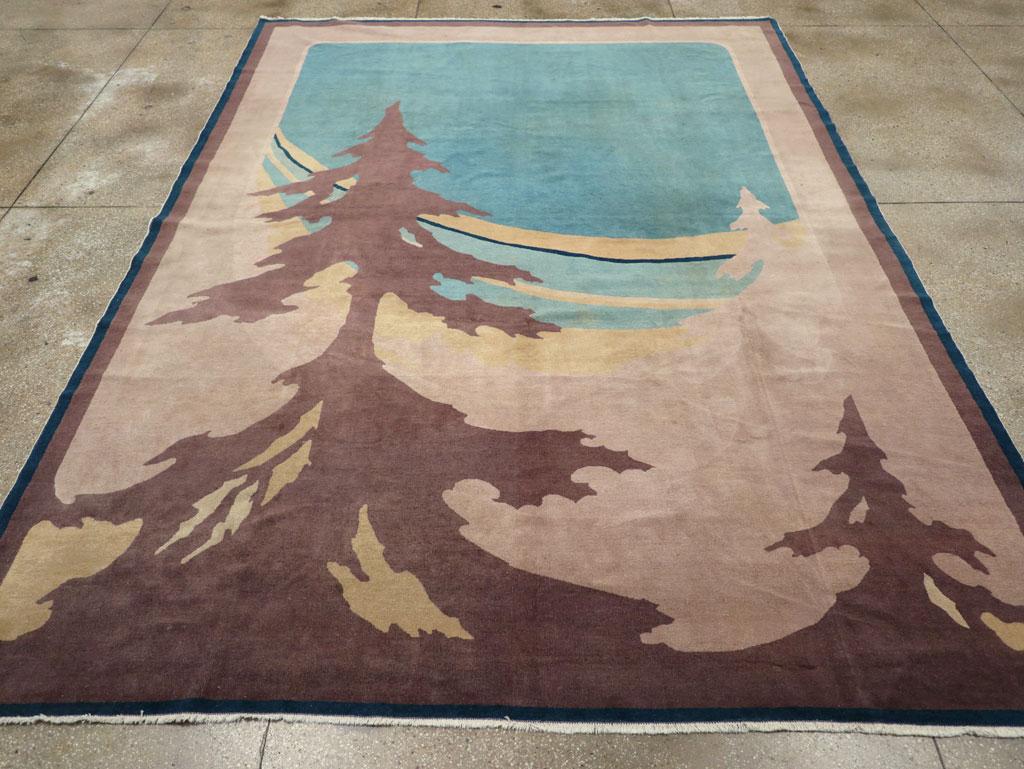 This mid-20th century Chinese Art Deco rug, measuring 9' 3