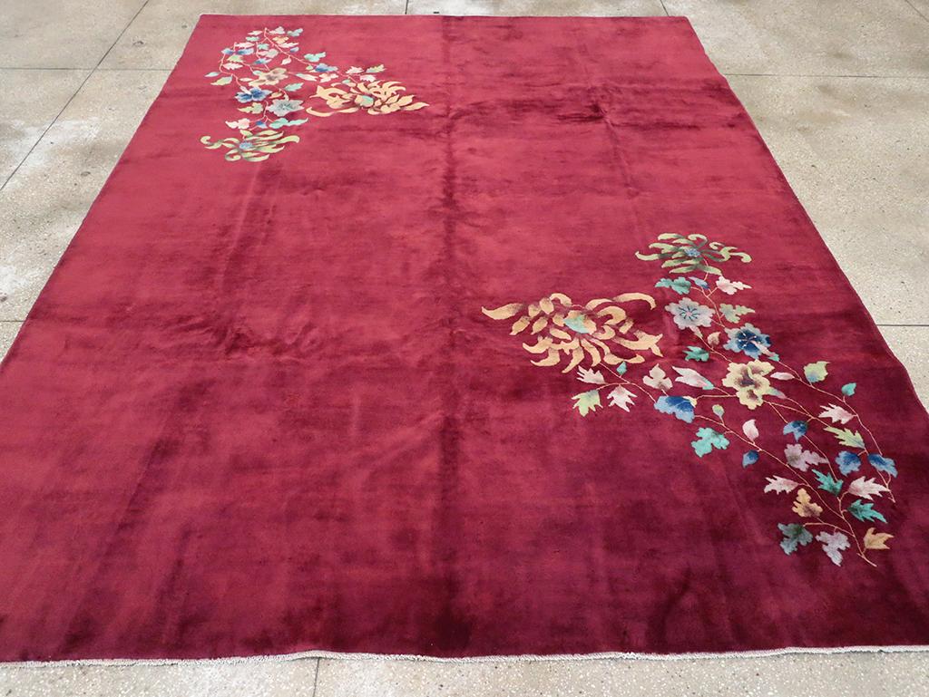 This elegant Mid-20th century Chinese Art Deco rug, measuring 8' 9