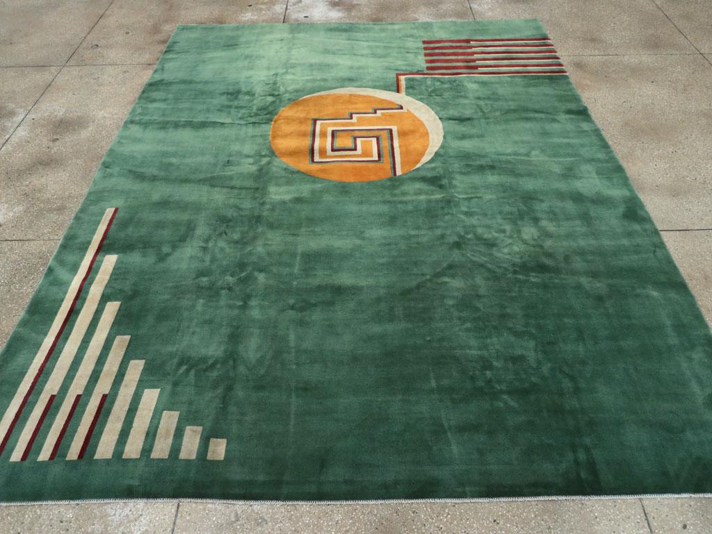 This striking Mid-20th century Chinese Art Deco rug, measuring 9' 1