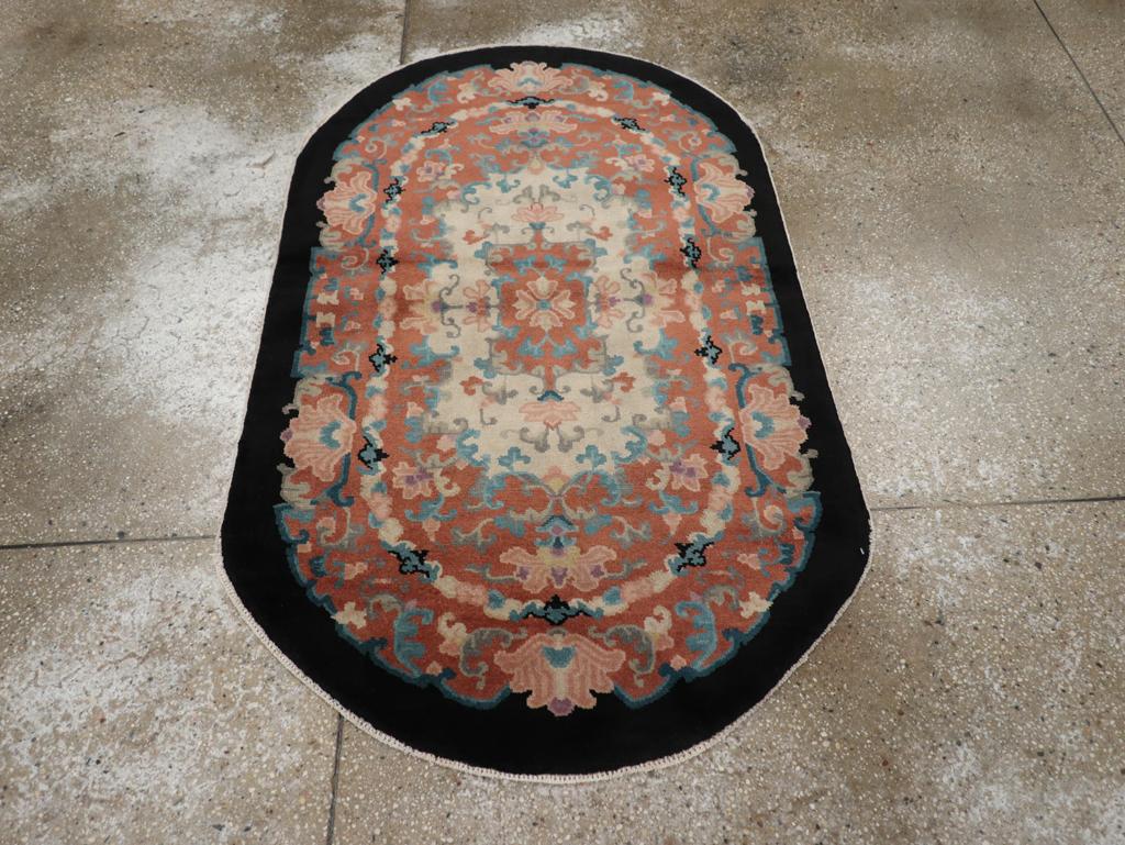 This mid-20th century Chinese Art Deco rug, measuring 4' 0