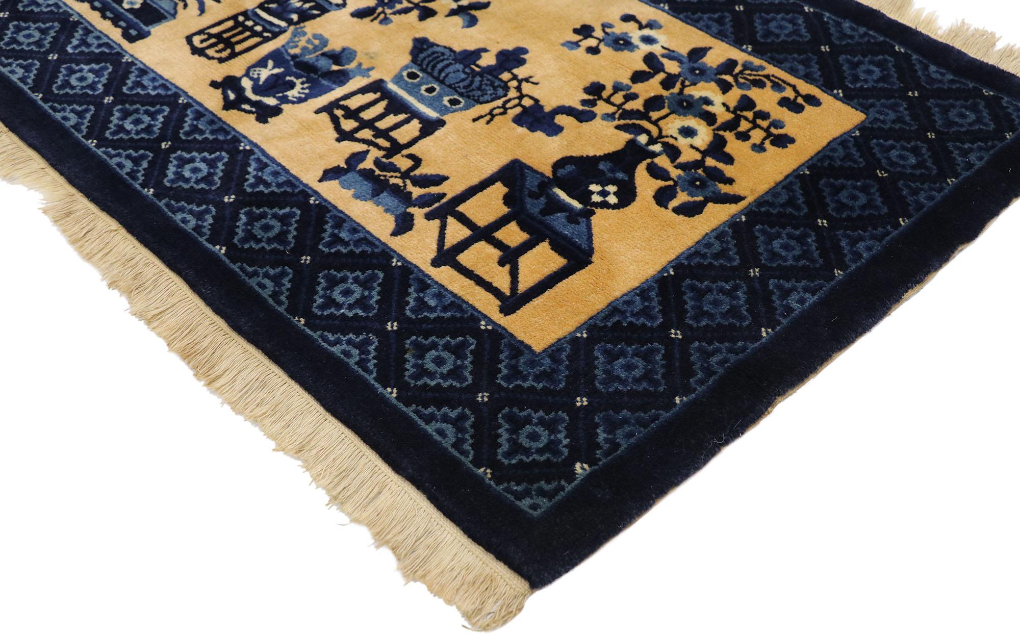 77593 Vintage Chinese Baotou vase pictorial rug with Chinese Chippendale Style 02'05 x 04'06. This hand-knotted wool vintage Chinese Baotou pictorial rug features an abrashed tan field showcasing different types of cloisonné vases sprouting with