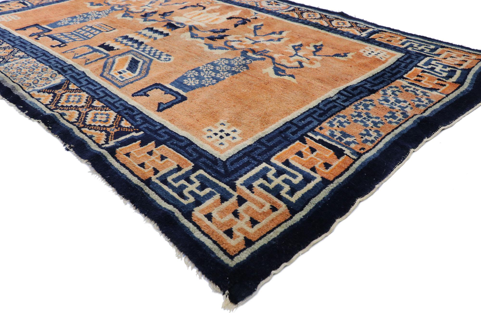 78027 vintage Chinese Baotou vase Pictorial rug with Chinese Chippendale style 04'03 x 06'08. This hand-knotted wool vintage Chinese Baotou pictorial rug features an abrashed burnt orange field showcasing different types of cloisonné vases sprouting