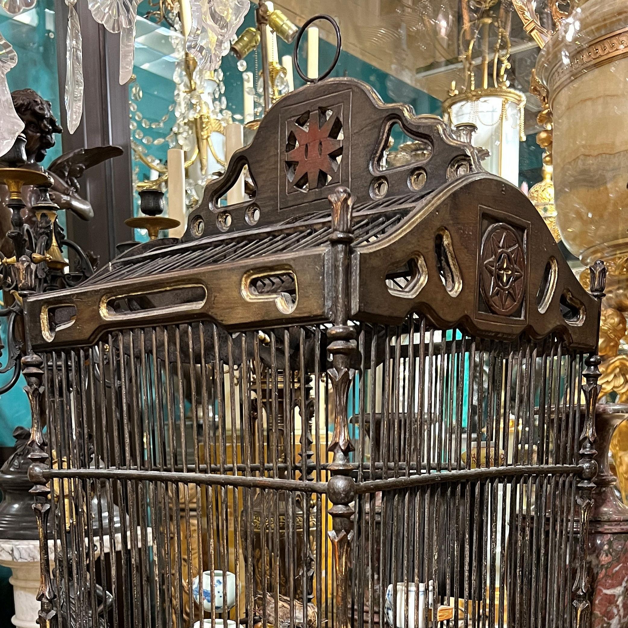 Vintage  Chinese Bird Cage with Porcelain Feeders In Good Condition For Sale In New York, NY