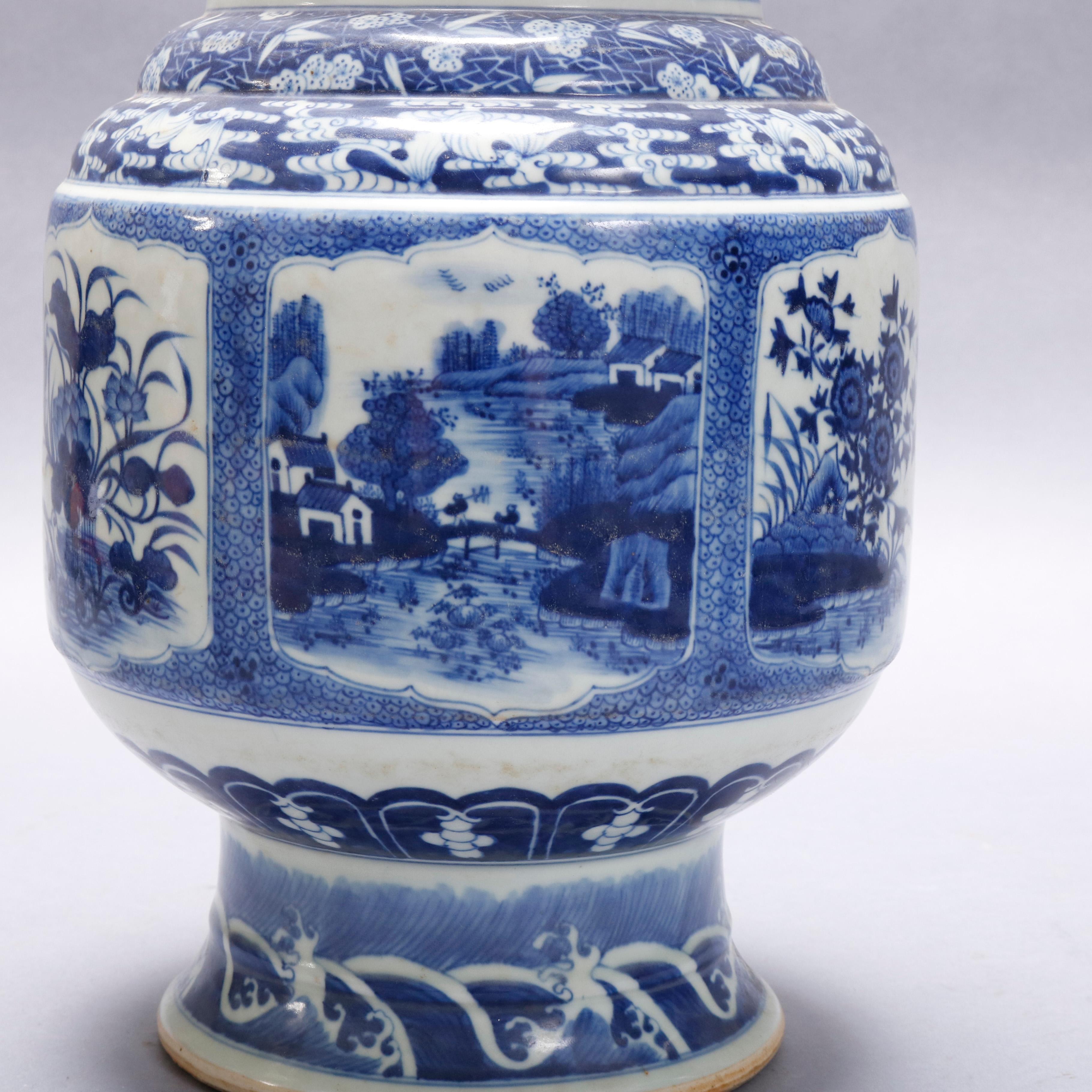 A vintage Chinese porcelain tall vase offers urn form with blue and white paneled landscape decoration, 20th century

Measures- 19