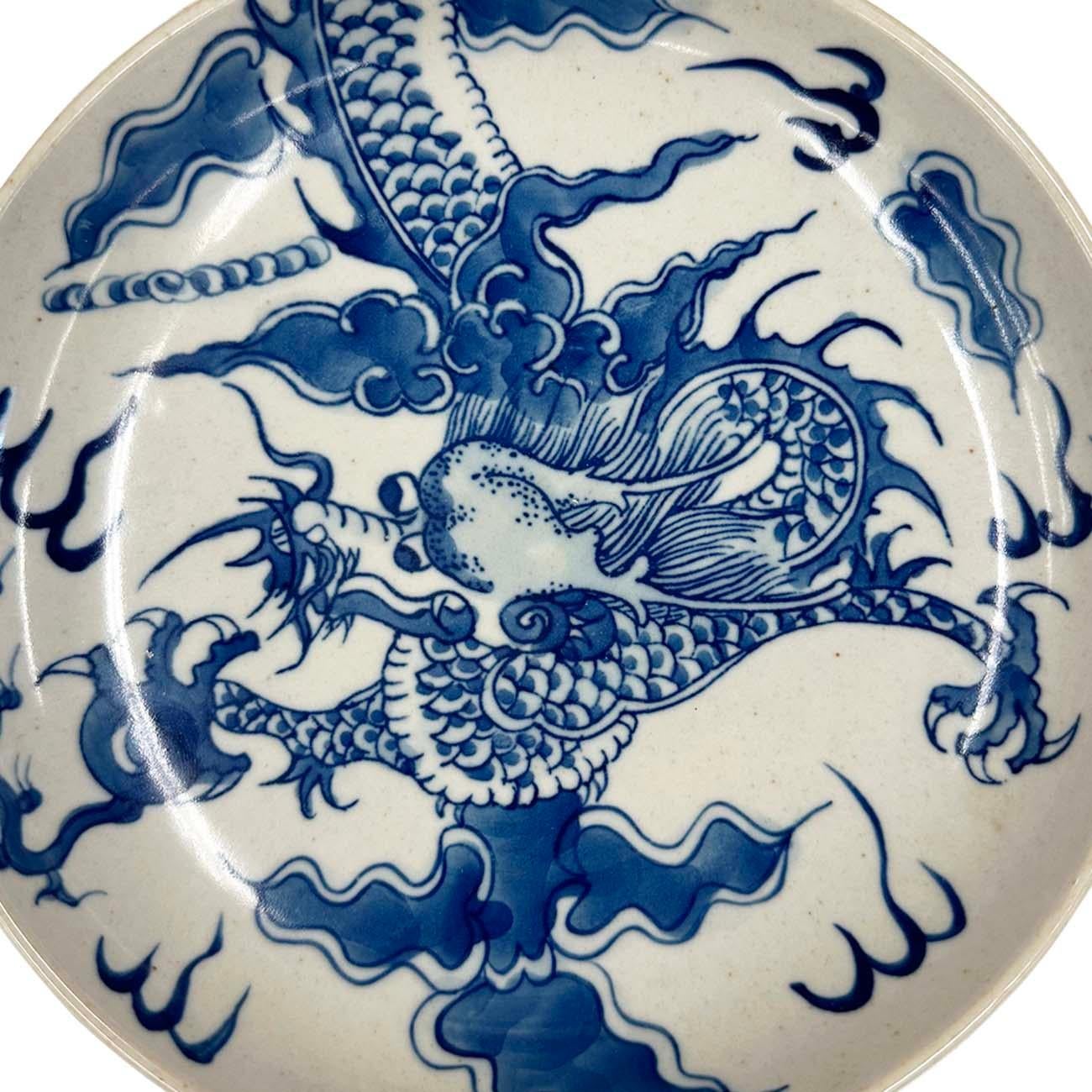 This Vintage Blue and White Porcelain Plate is hand made with hand Paint dragon design on it. Very good quality porcelain and beautiful pattern. Look at the detailed pictures, very good vintage condition with some age wears. it will be a beautiful