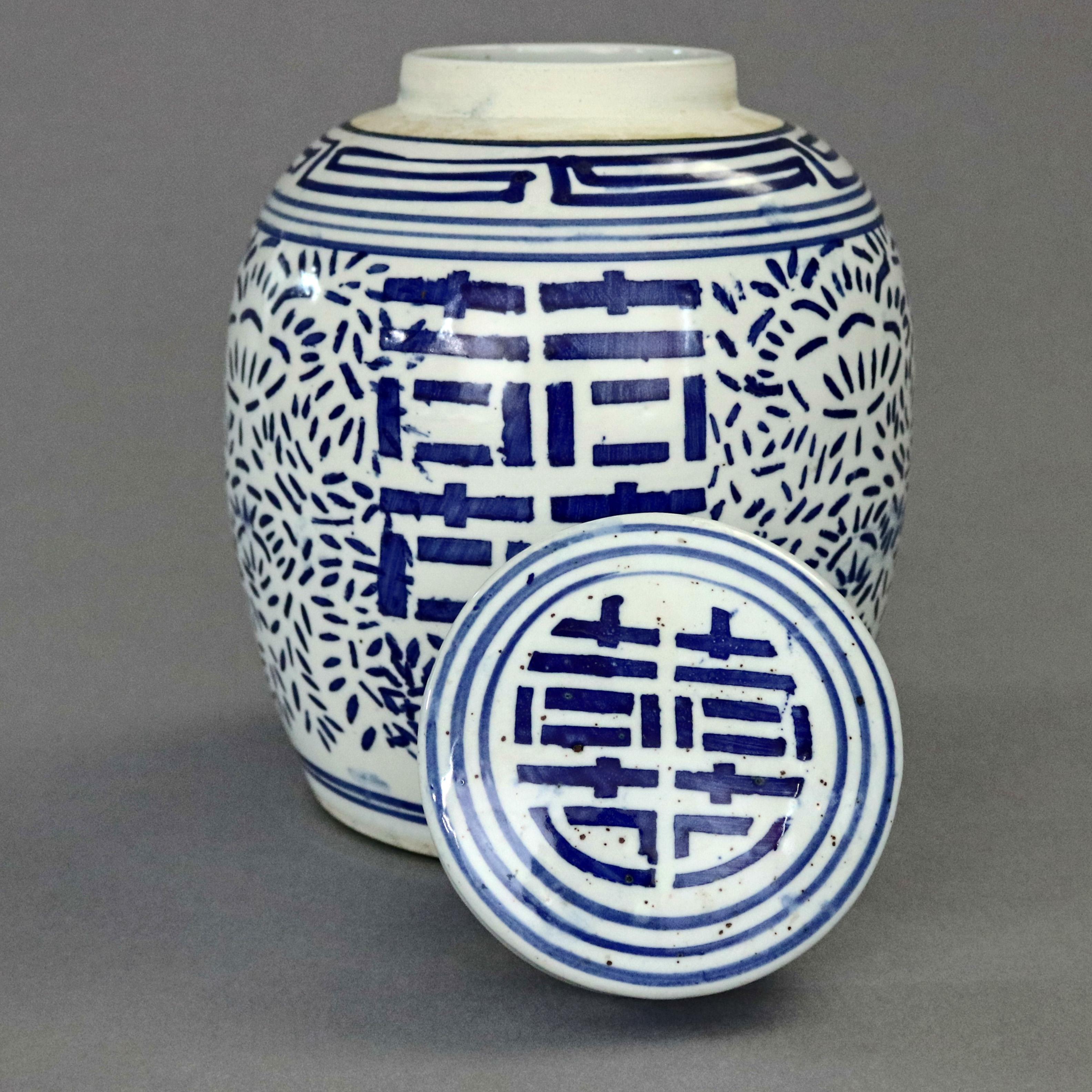 Vintage Chinese blue and white porcelain ginger jar offers hand painted all-over stylized foliate decoration with central double happy symbol, 20th century

Measures: 9.5