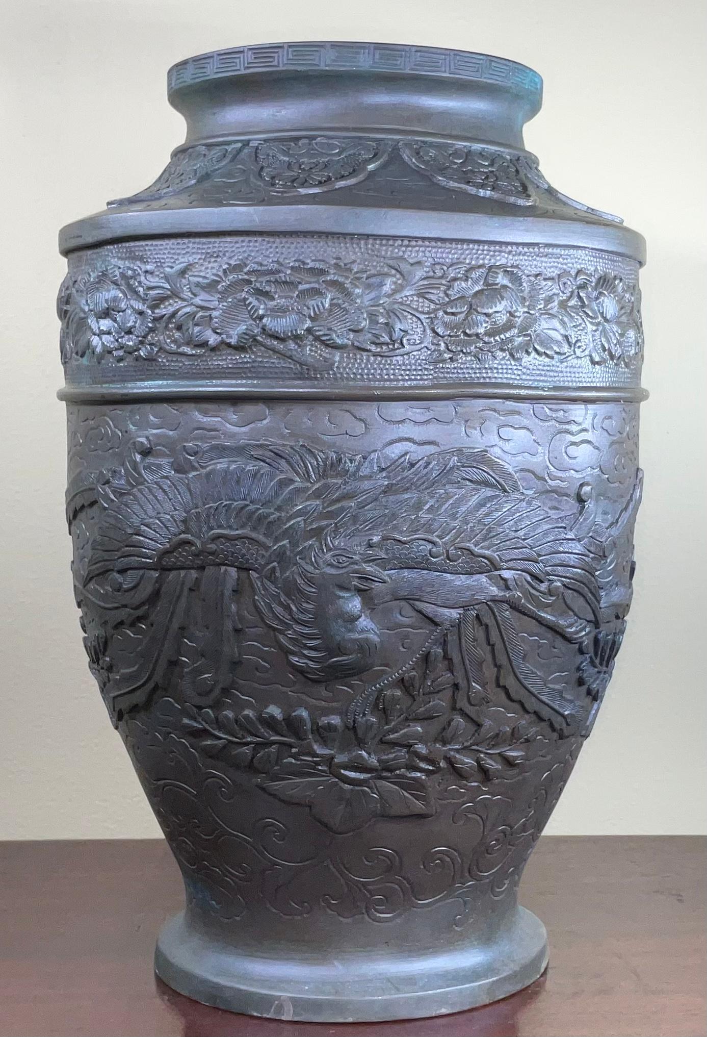 Beautiful vase made of solid bronze hand etched of floral motifs with exceptional bird spreading its wings.
The vase can not hold water (two holes on the bottom)
Signature mark on the bottom.