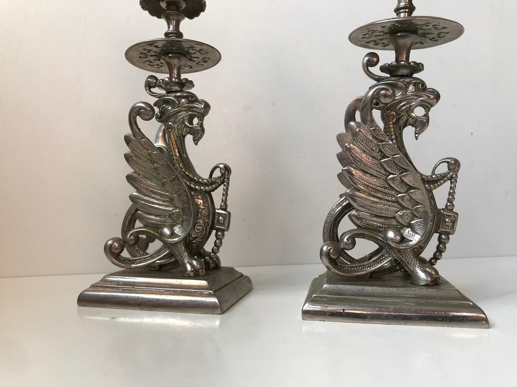 A griffin dragon is a mythical winged creature with the body of a lion and the head and claws of an eagle. The Griffin or Griphon has long been considered as a great protector in Chinese culture. This particular set of silver or nickel-plated