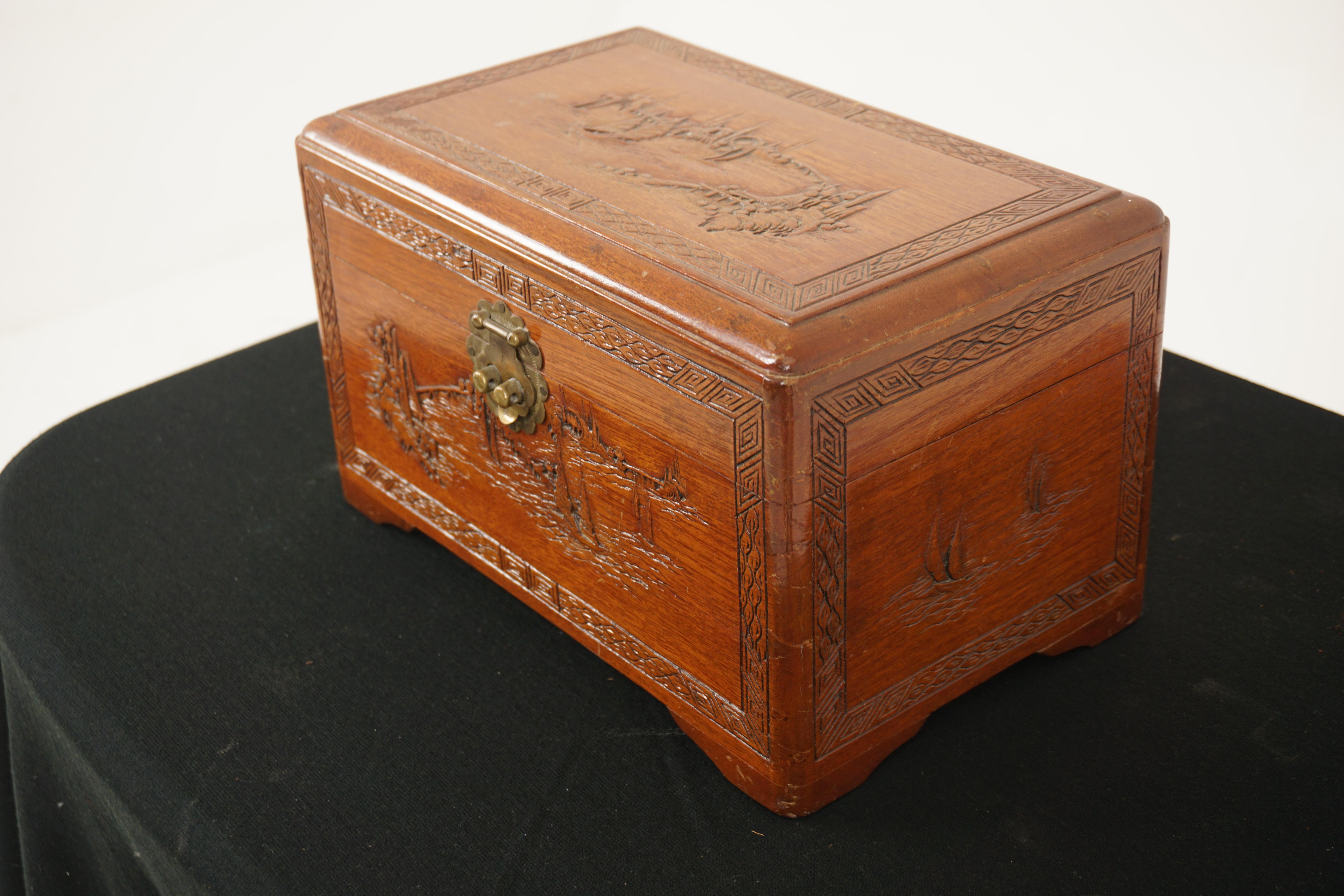 Vintage Chinesecarved camphorwood jewellery box, China 1930, H895

China,1930
Solid Camphor wood.
Original finish.
Carved lift up lid.
With left out tray interior.
Original brass lock.
Carved front back and side.
All standing on bracket