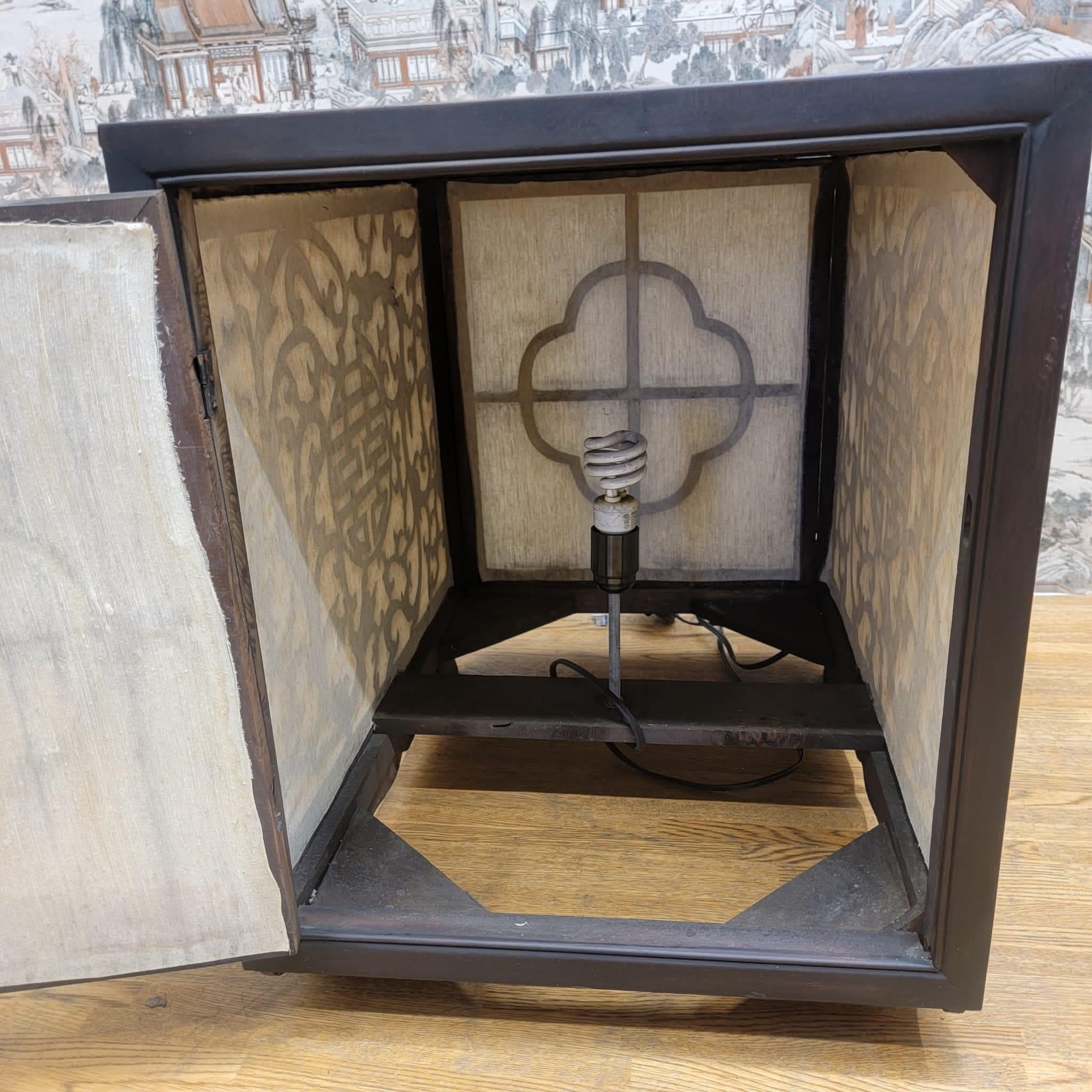 Vintage Chinese Carved Decorative Elm Side Tables with Light

These vintage chinese carved elm side tables have a removal panel to replace the light. Both tables are in working condition and have been tested. These side tables have their original