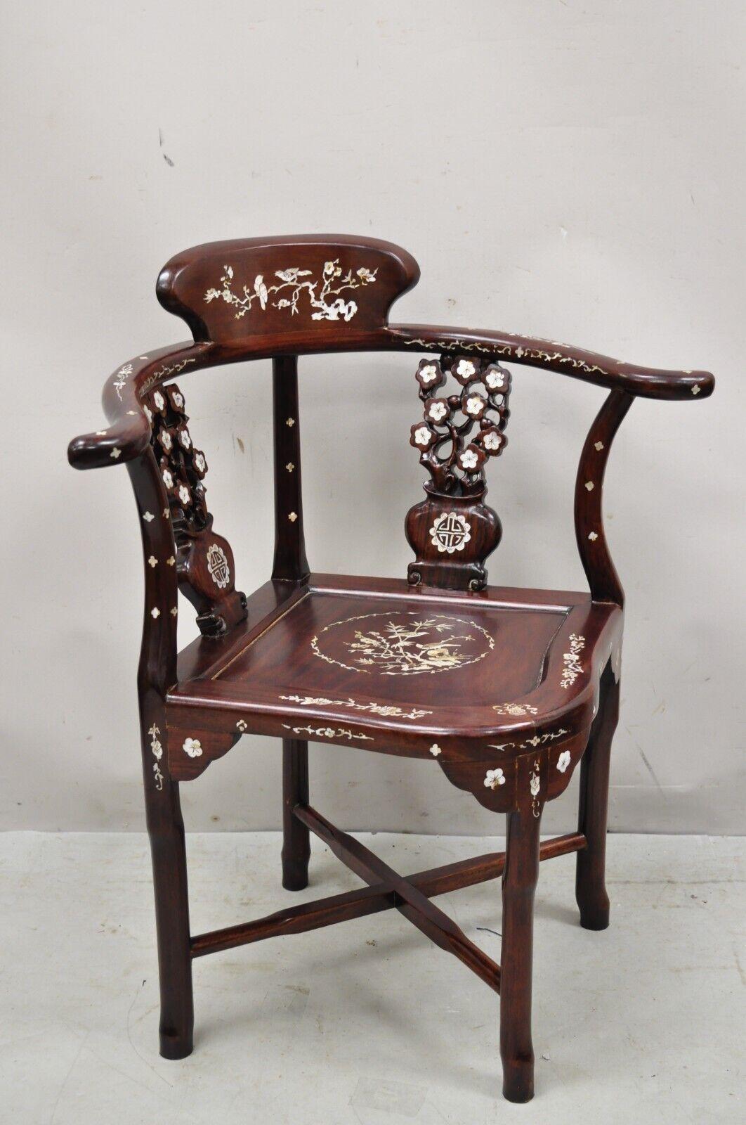 Vintage Chinese Carved Hardwood Corner Lounge chair with Mother of Pearl Inlay. Item features Impressive mother of pearl inlay throughout, stretcher base, solid wood construction, beautiful wood grain, very nice vintage item. Circa Mid to Late 20th