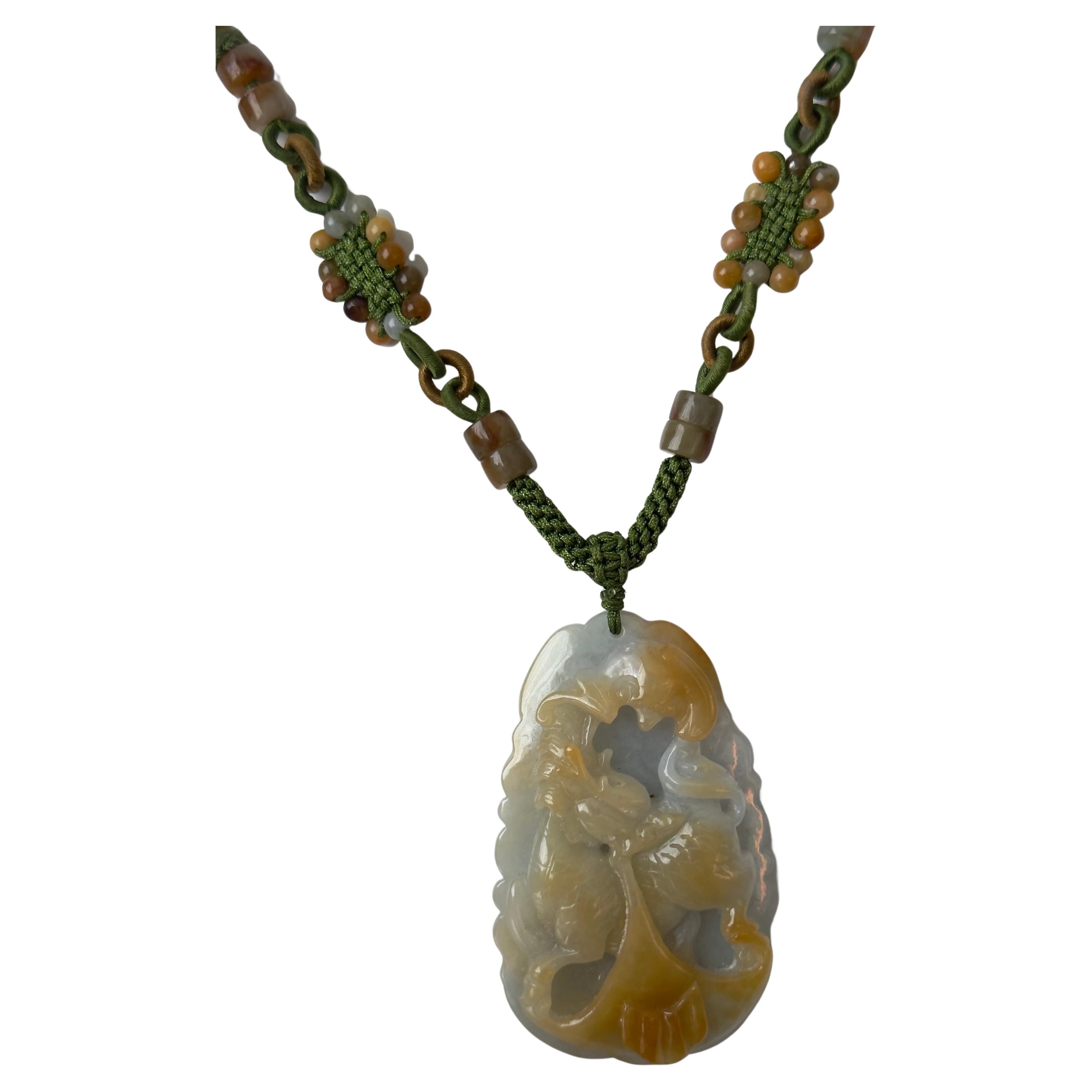 Vintage Chinese Carved Jadeite Pendant 
Stunning hand carved jadeite pendant, light gray to delicate honey color. Fine details depicts a galloping dragon horse. About 2.75 inch long and little over 1.5 wide it weight about 70.69 grams. Presented on