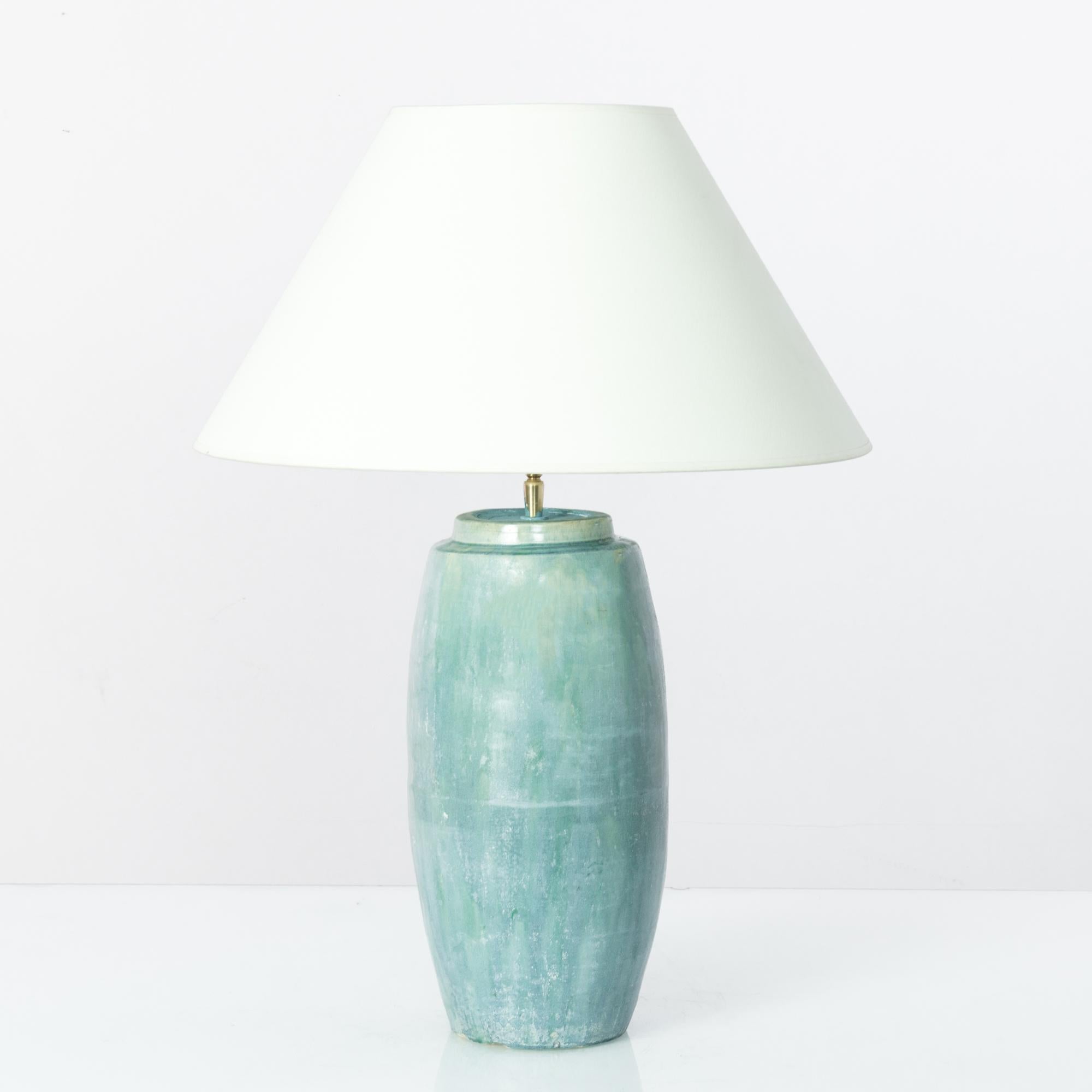 This finely crafted vintage Chinese vase has been fitted with an adjustable brass fixture and E26 lighting socket. Polished brass meets the seductive turquoise green glaze for an uncompromising contrast. Textured glazes, attractive colors and clean