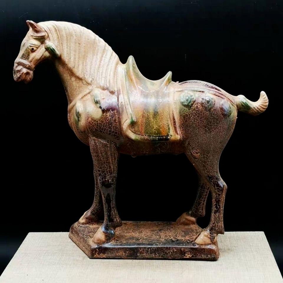 This Vintage Chinese Ceramic Color Horse Statue is a stunning example of traditional Chinese craftsmanship and artistry. Handcrafted from fine ceramic, the statue beautifully depicts a vibrant, galloping horse, adorned in rich, colorful glazes that