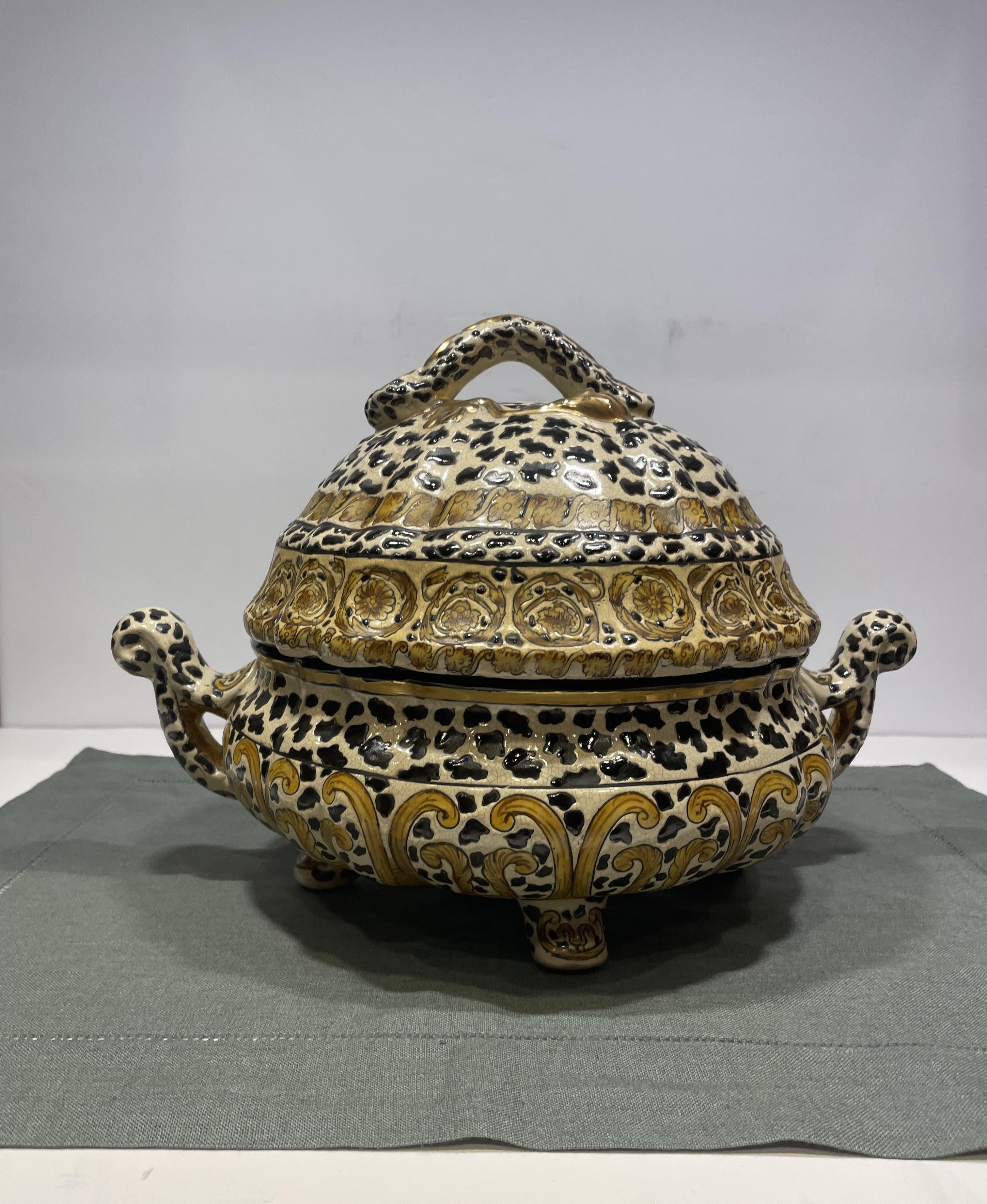 A vintage Chinese decorative tureen that's very 'of the moment' with it's animal motif in browns, blacks, creams and gold. A stunning and versatile accent piece for any room. A beautiful place to house a collection of anything from wrapped candies