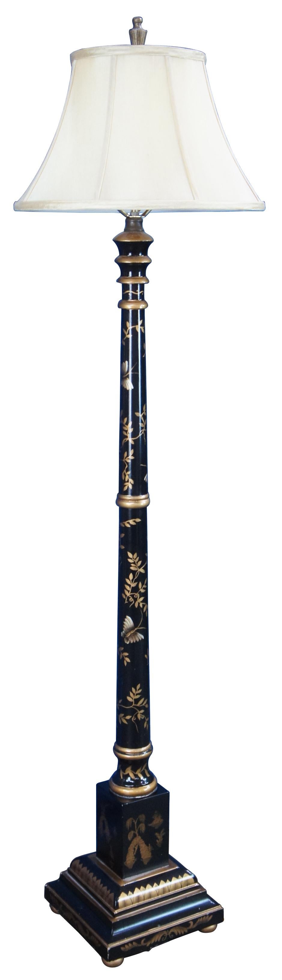 Vintage Chinese floor lamp featuring black lacquered design with gold detail showing a landscape of islands with floral accents and butterfly.

Measures: 10