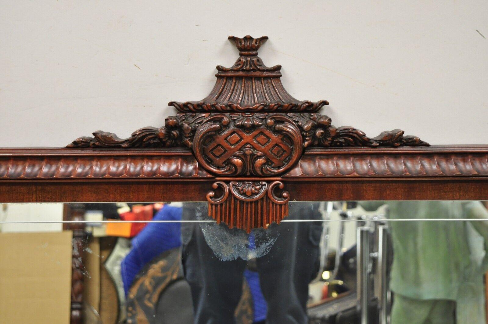 Vintage Chinese Chippendale Carved Mahogany Pagoda Large Wall Mirror. Item features a carved pagoda pediment, solid wood frame, beautiful wood grain, nicely carved details, very nice vintage item, great style and form. Circa Mid 20th
