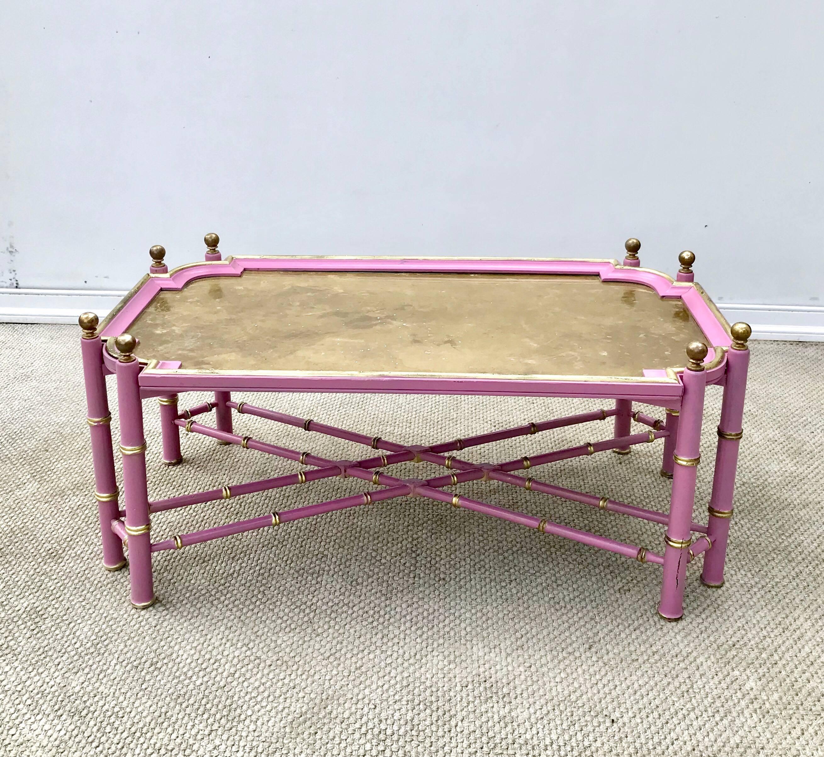Chic and pretty vintage Chinese Chippendale styled coffee table of faux bamboo form wood base and removable tray top having a distinctive patinated brass top. Recently tricked out in a hand applied orchid pink enamel, this table has classic lines