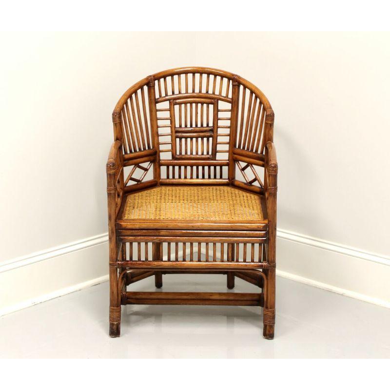 A Chinese Chippendale style armchair, unbranded. Faux bamboo with cane seat and rattan wrap. Features an intricate design to back, arms and apron, with stretcher base and round legs. Made in Philippines, in the late 20th century.

Measures: Overall: