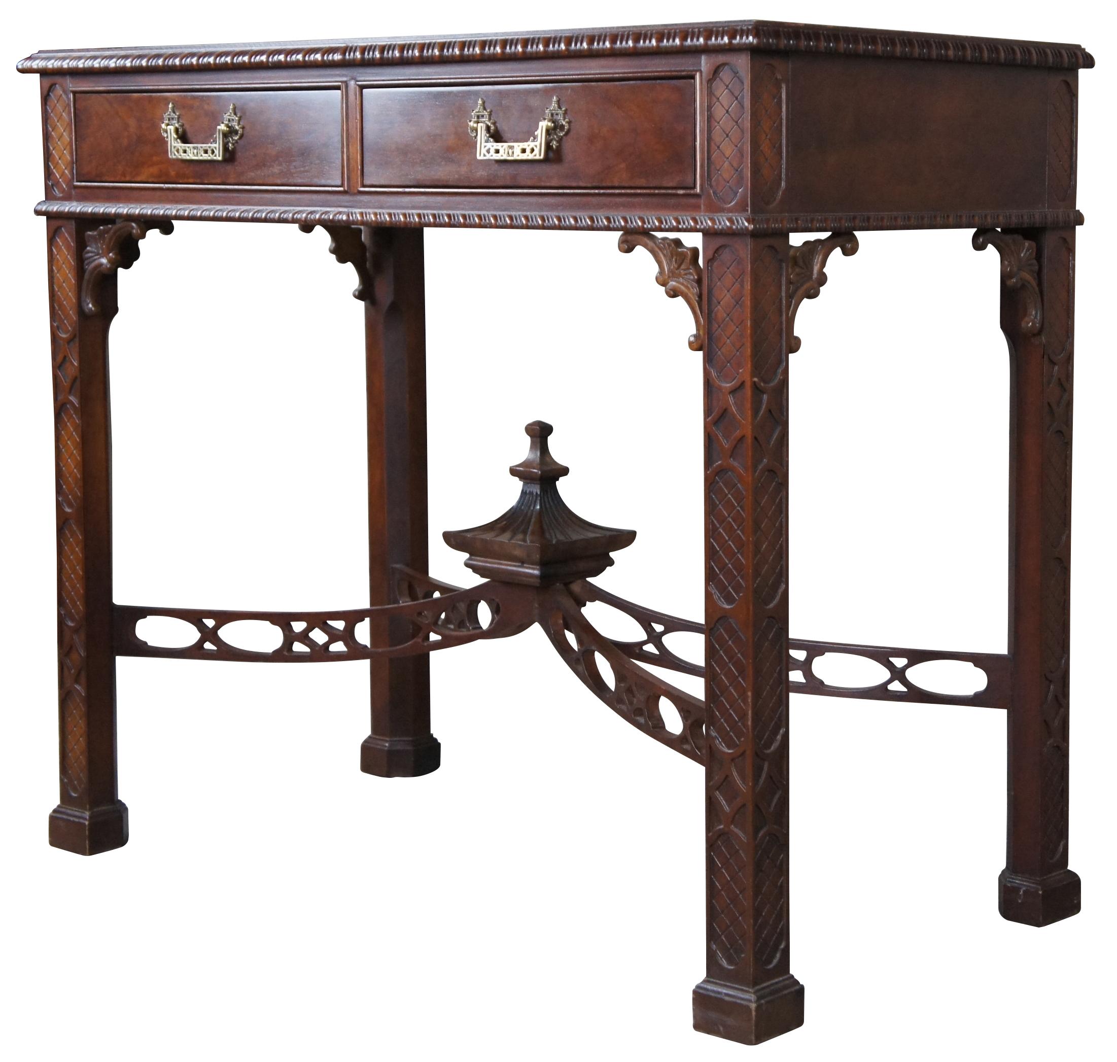 Mid 20th Century Chinese Chippendale Console table or server. A rectangular form made mahogany with two dovetailed drawers and pagoda form hardware.  Features gadrooned aprons, ornate spandrals and lattice carved stiles and legs.   The table is