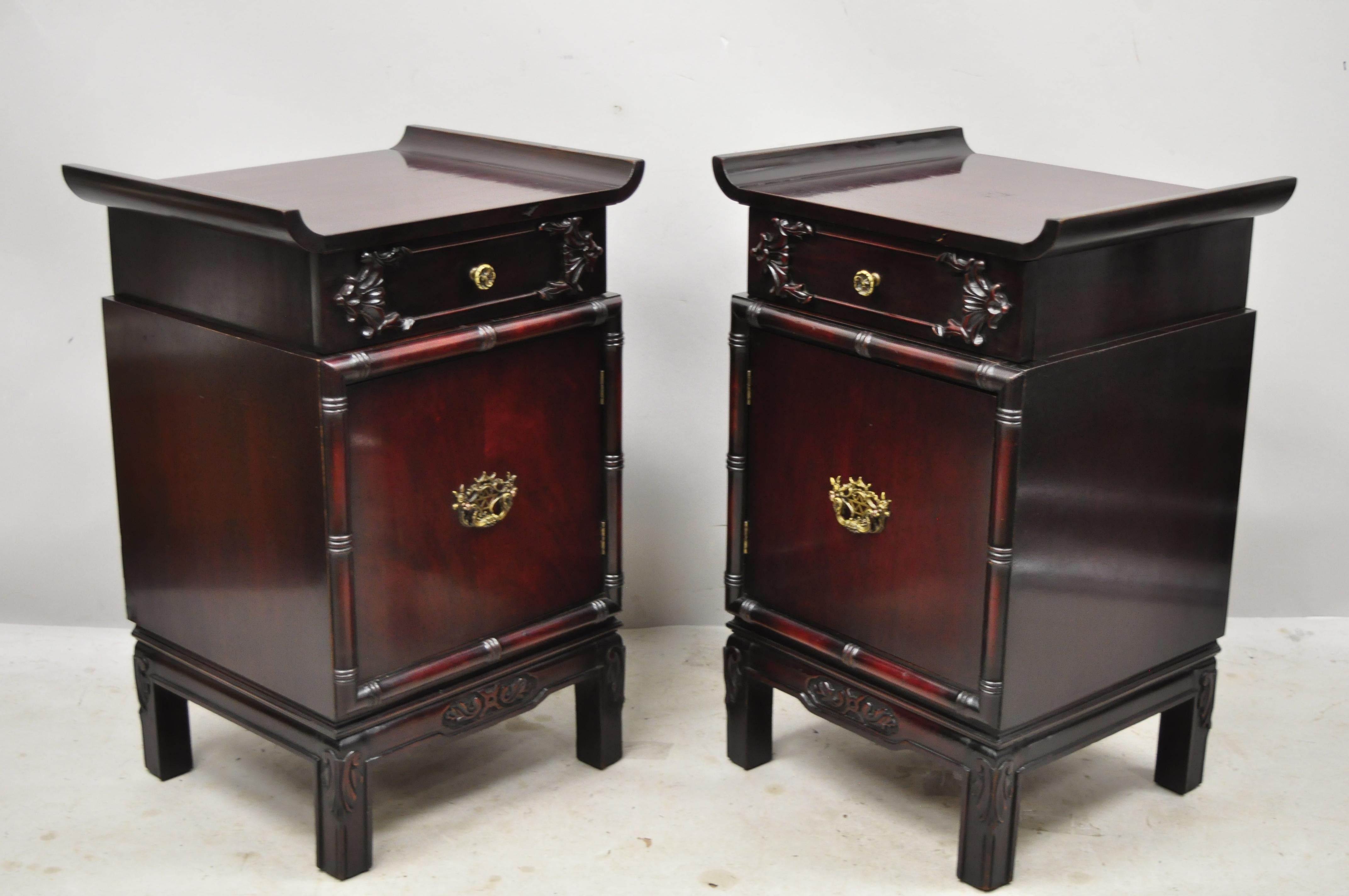 Vintage Chinese Chippendale pagoda top mahogany faux bamboo nightstands - a pair. Item features faux bamboo carved details, pagoda top, beautiful wood grain, 1 swing door, 1 drawer, solid brass hardware, great style and form, Circa early to mid