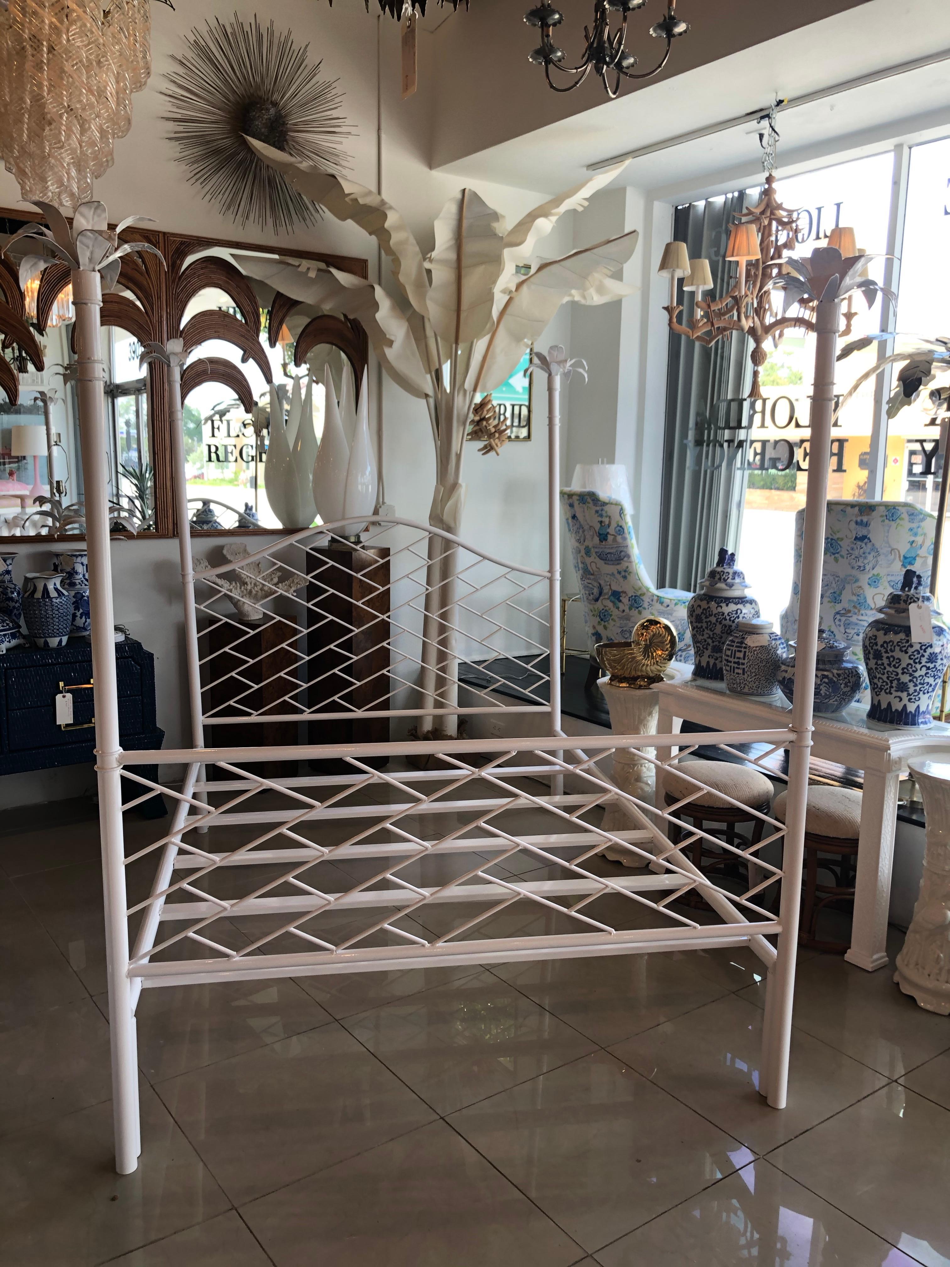 Amazing vintage Chinese Chippendale queen or full size four poster bed post bed. Palm tree leaf finials. All metal, newly powdercoated in a white gloss finish. Includes headboard, footboard, and mattress rails. The finials add to the overall size