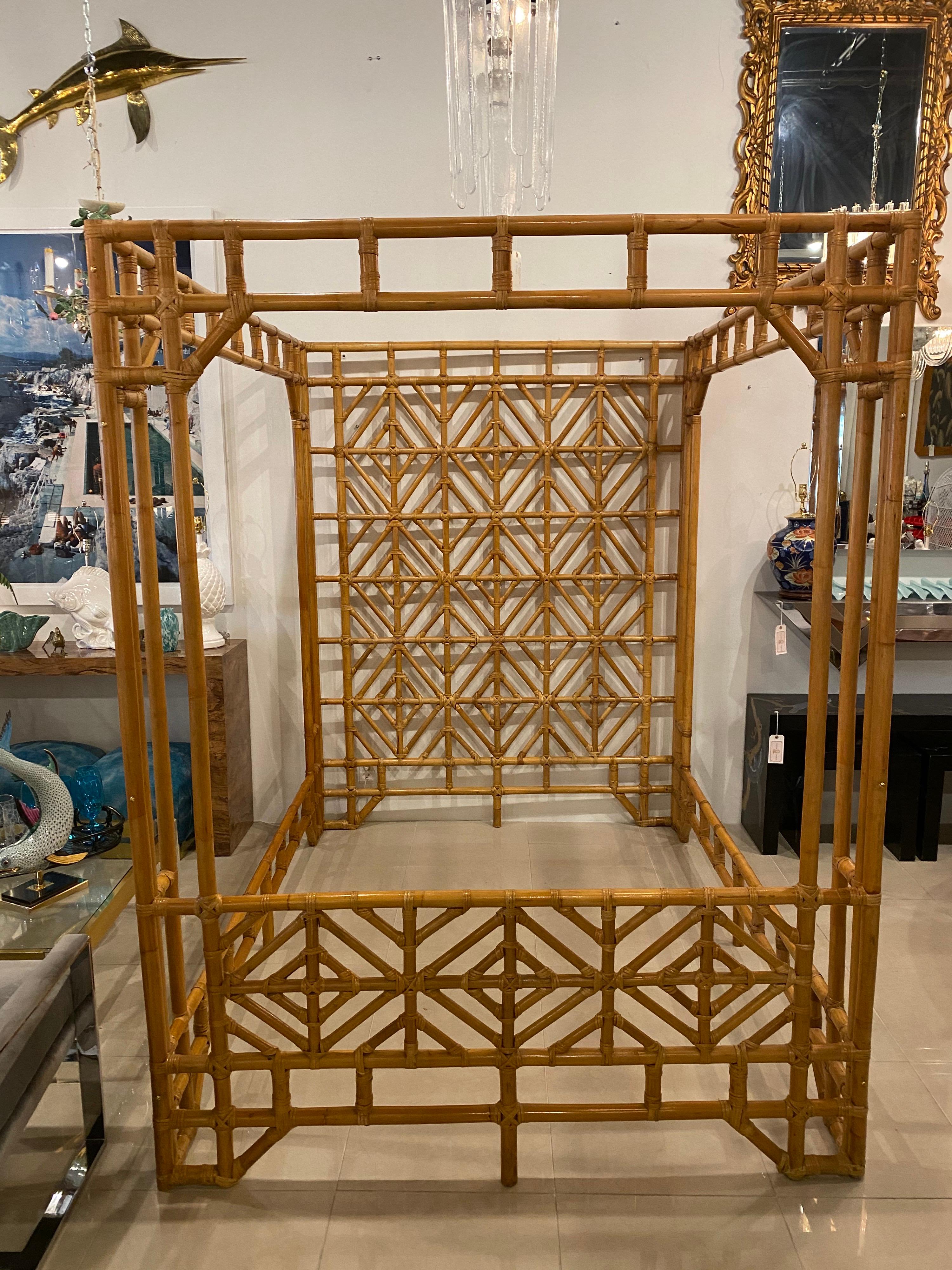Amazing vintage rattan Chinese Chippendale canopy bed. Queen Size. 6 pieces come together for assembly. You would use a standard mattress frame for the middle. Perfect for the island, tropical vibe. Inside opening is 84