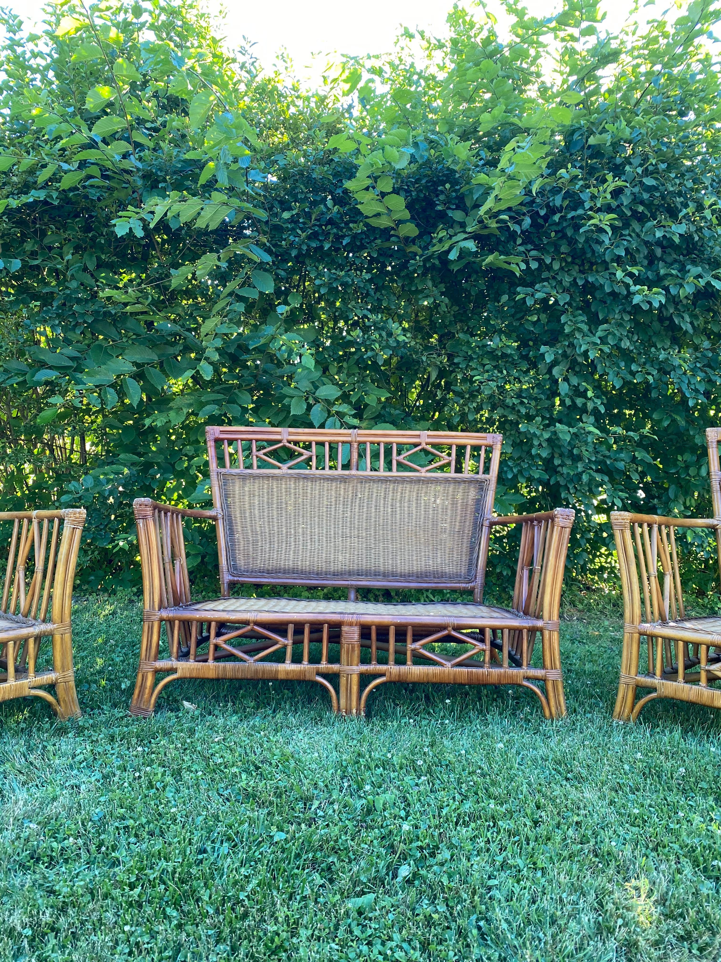 Beautiful set of vintage Chinese chippendale rattan settle with 2 matching chairs! Add in new cushions and you will be enjoying the rest of summer on these! Although the seat, backs and structure is all in tact, some of the bamboo is starting to