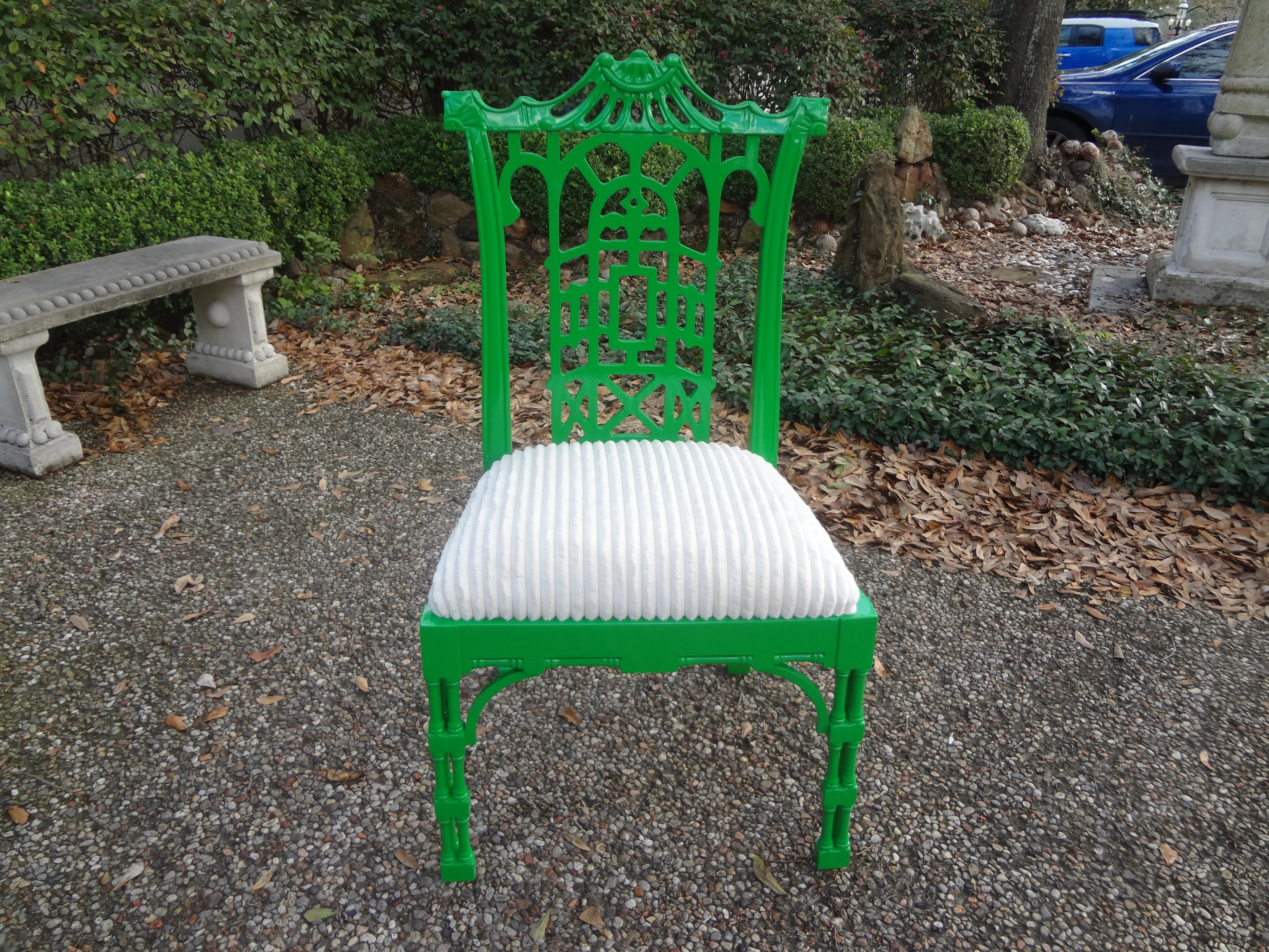 Vintage Chinese Chippendale style lacquered chair.
 Vintage Chinese Chippendale style chair in a gorgeous green lacquered finish. This Chinoiserie arm chair has beautiful detailing and has been professionally upholstered in a white cut velvet. This