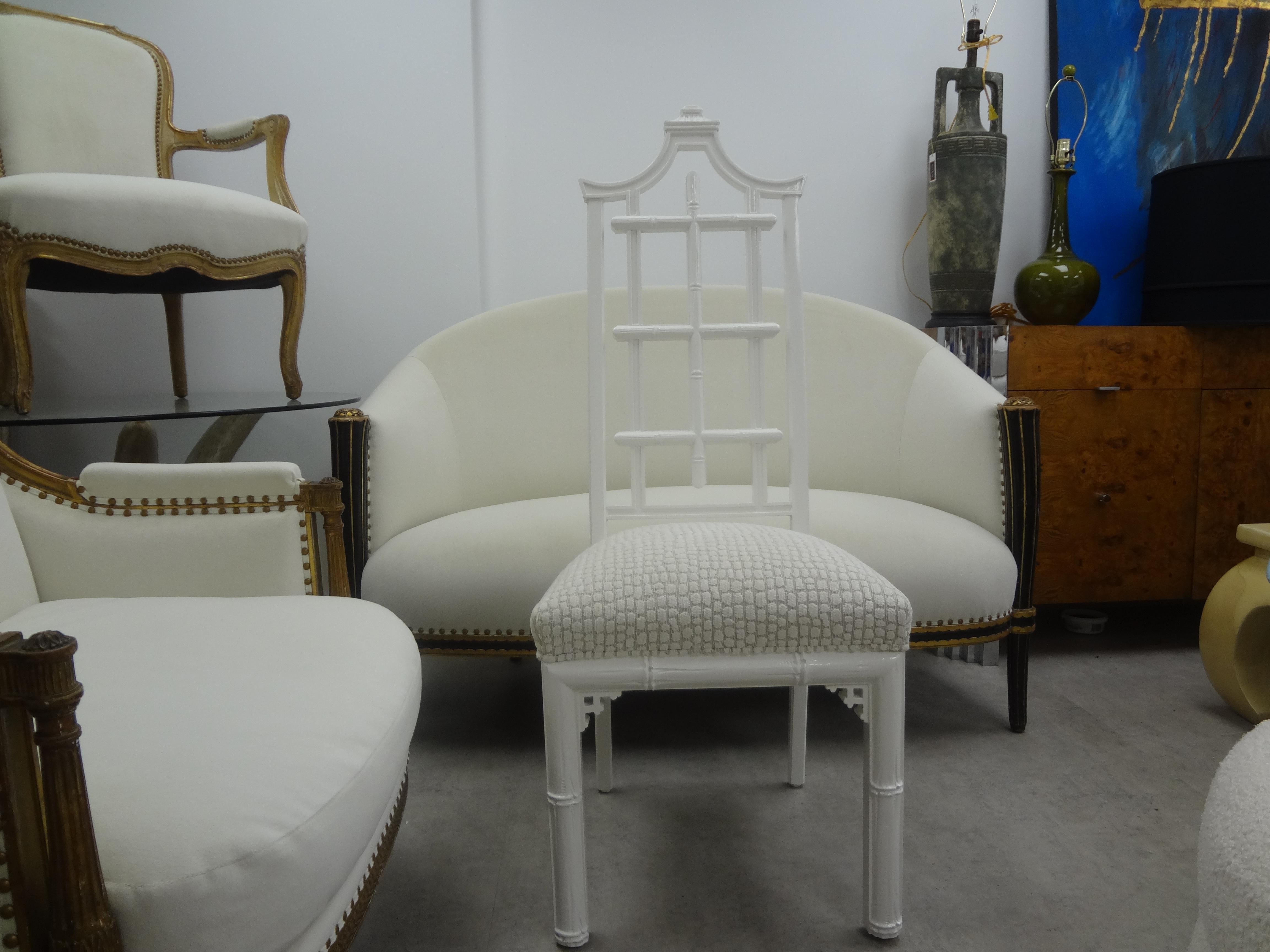 Vintage Chinese Chippendale style chair in a gorgeous white lacquered finish. This pagoda chair has beautiful detailing and has been professionally upholstered in a white cut velvet. This chair, side chair, desk chair or vanity chair is the perfect